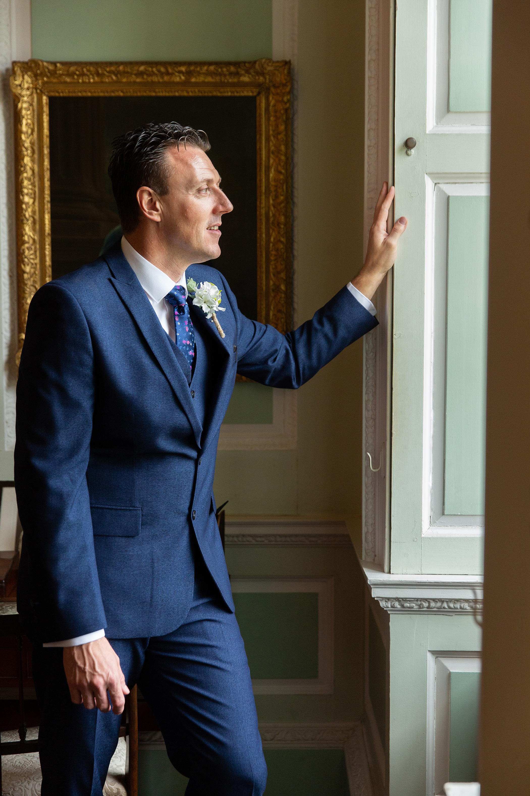 groom looking out of the window