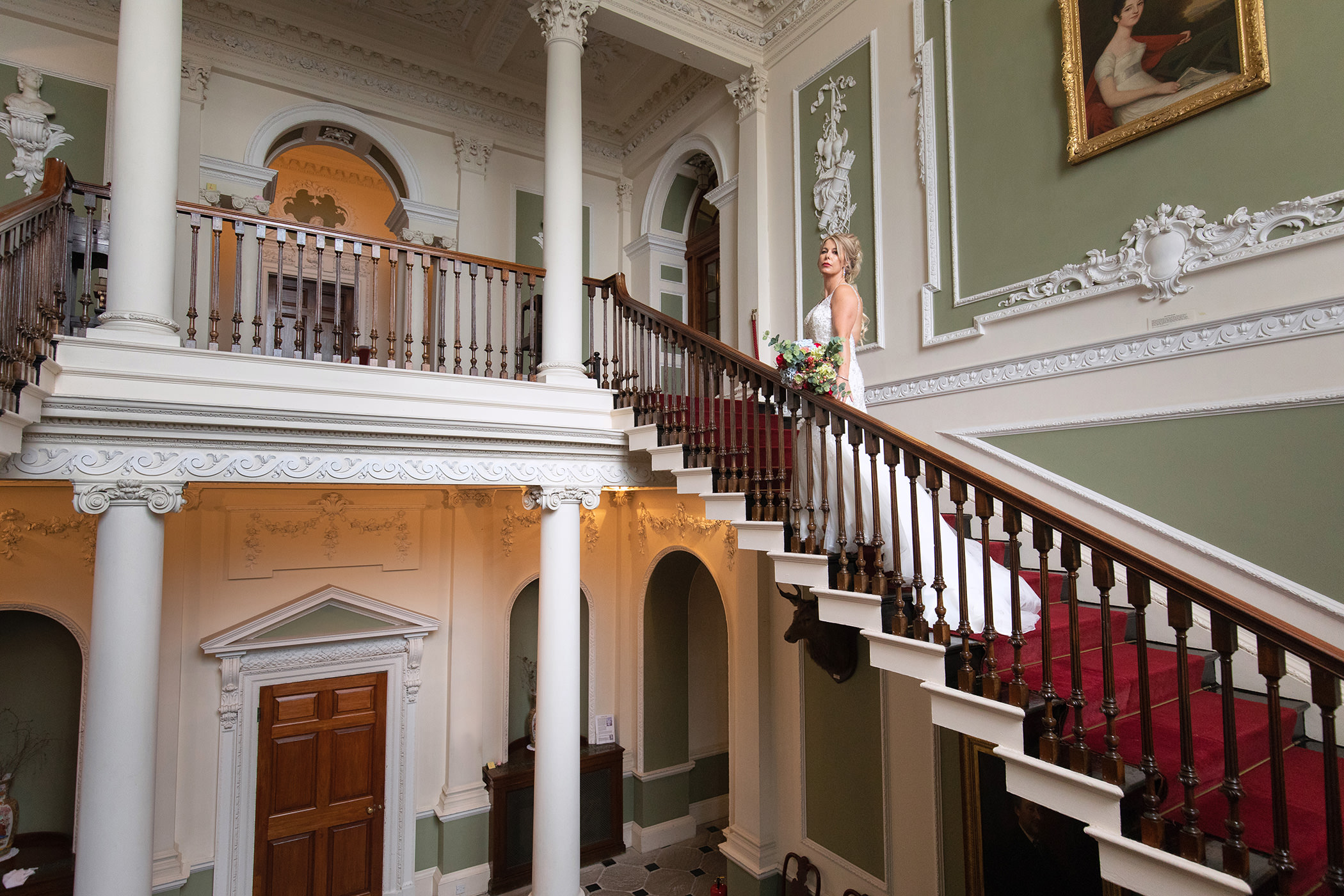 the bride on the lovely staircase at Lytham Hall