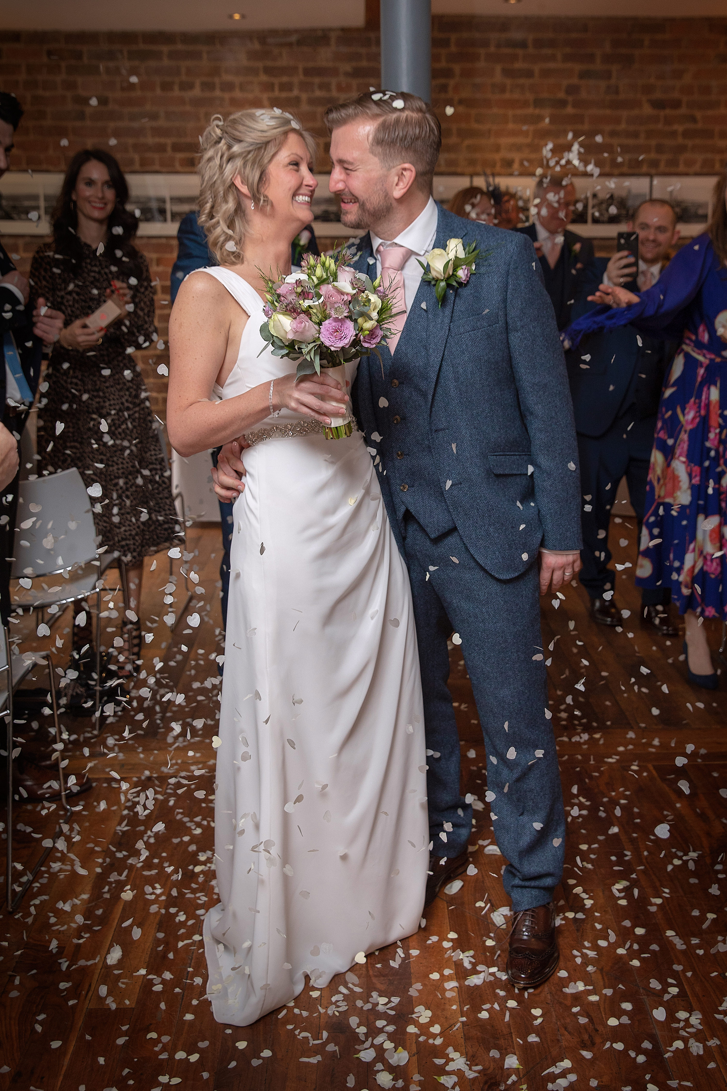 the bride and groom walk down the aisle 