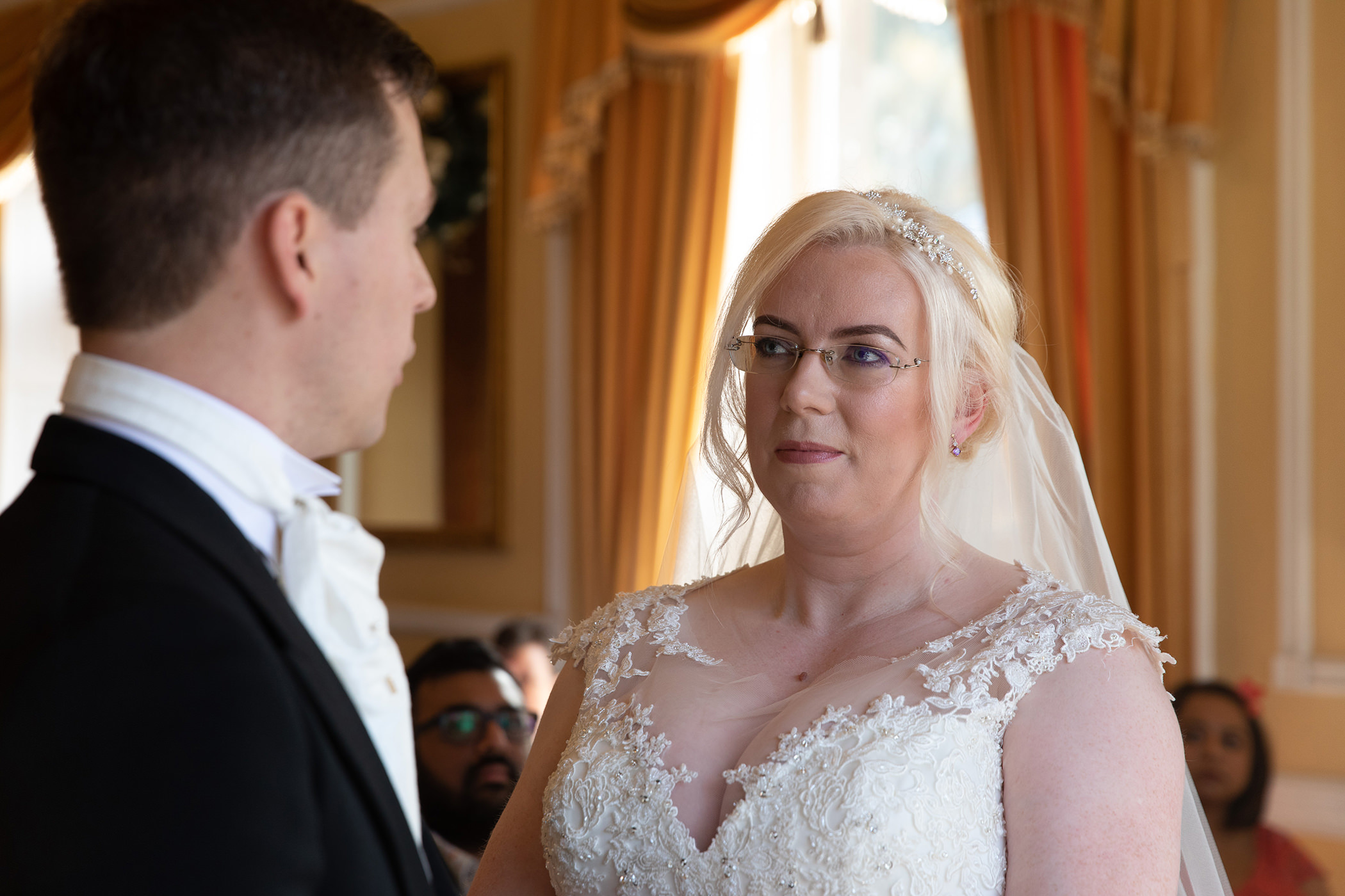 the bride Lucy looks into Simons eyes