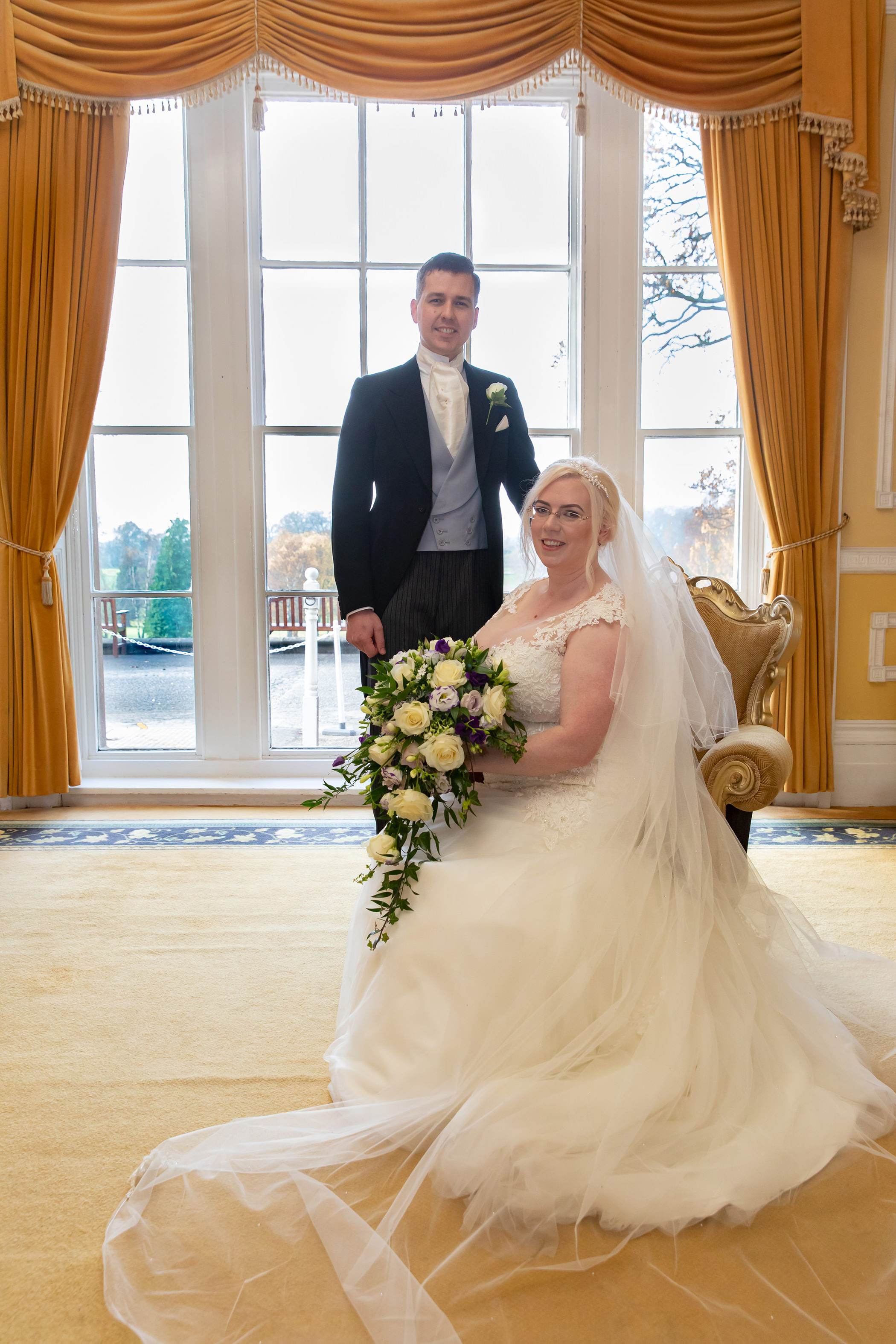 Simon and Lucy pose for their formal wedding photo