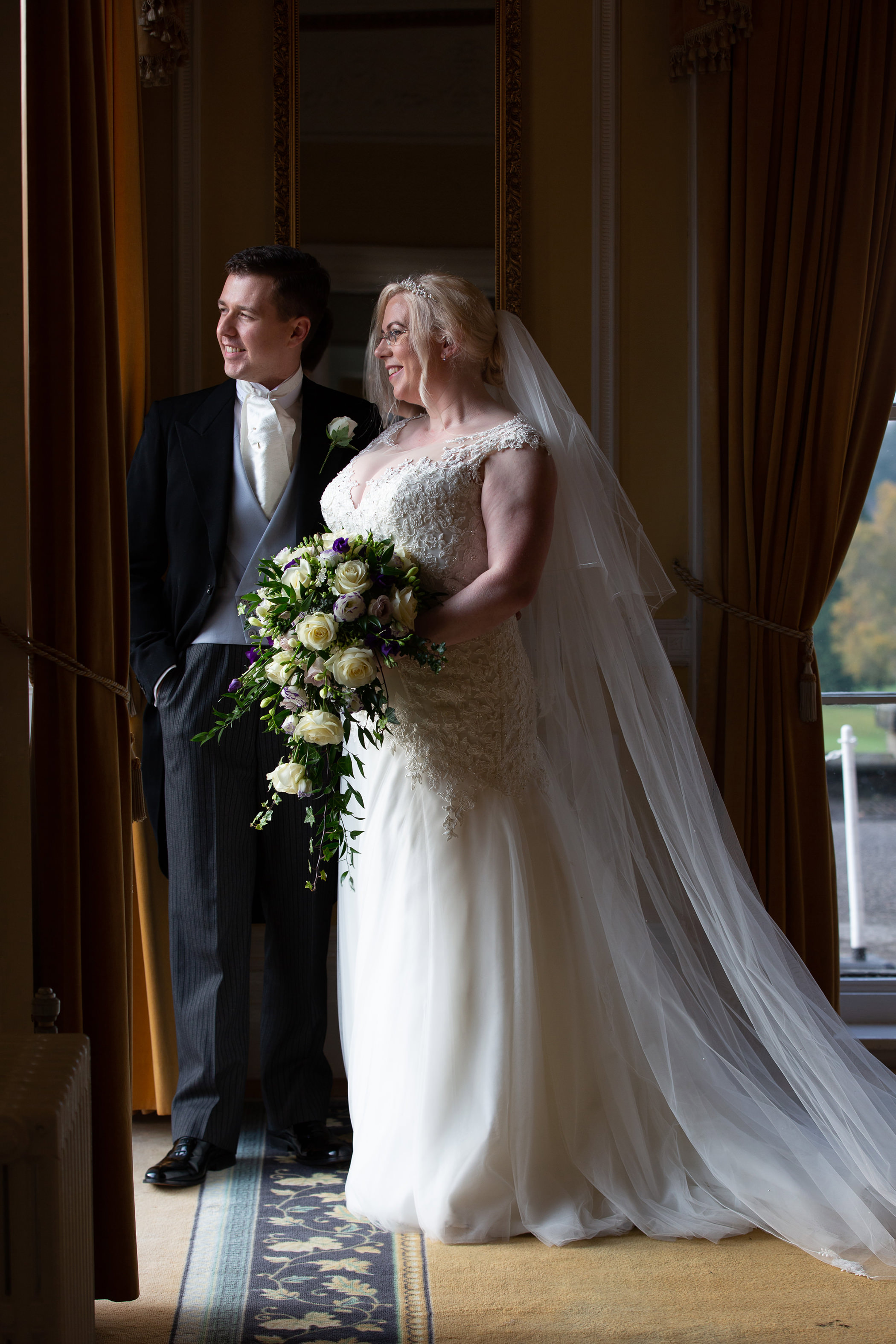 Simon and Lucy pose for their formal wedding photo