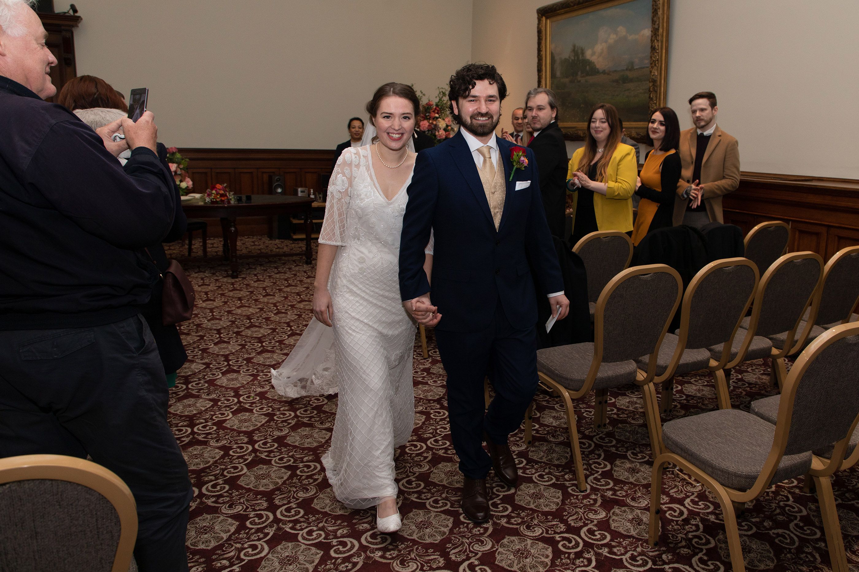 the happy couple leave the room