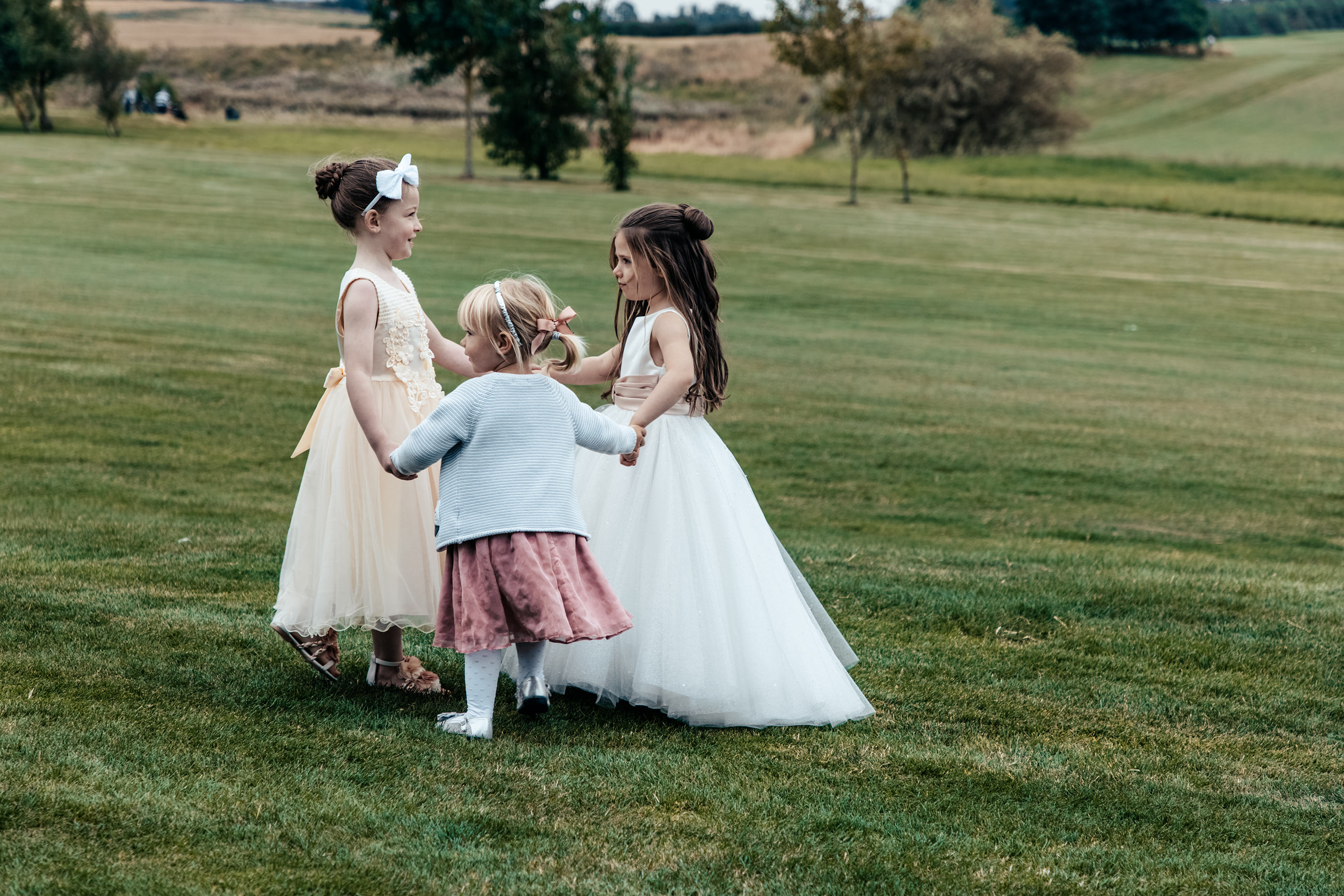 Flower girls playing in the field 