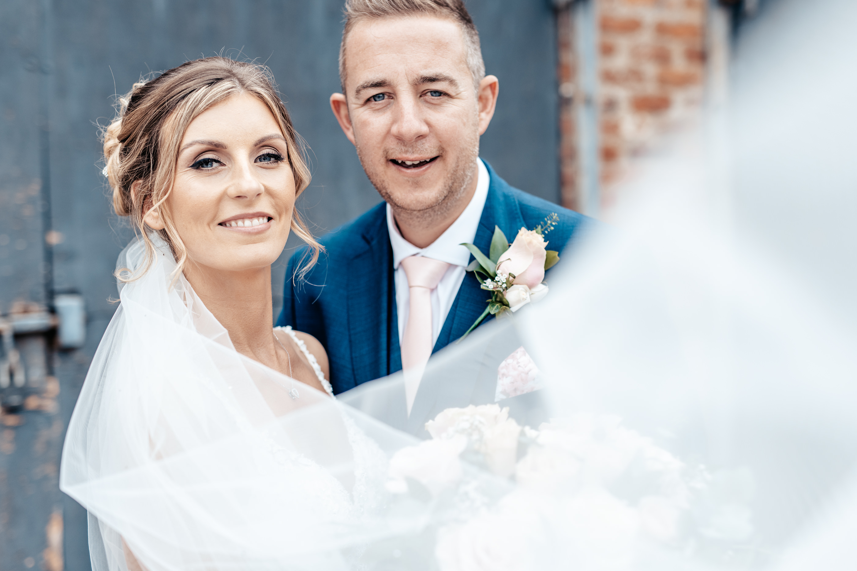 Bride and groom with the wedding Veil 