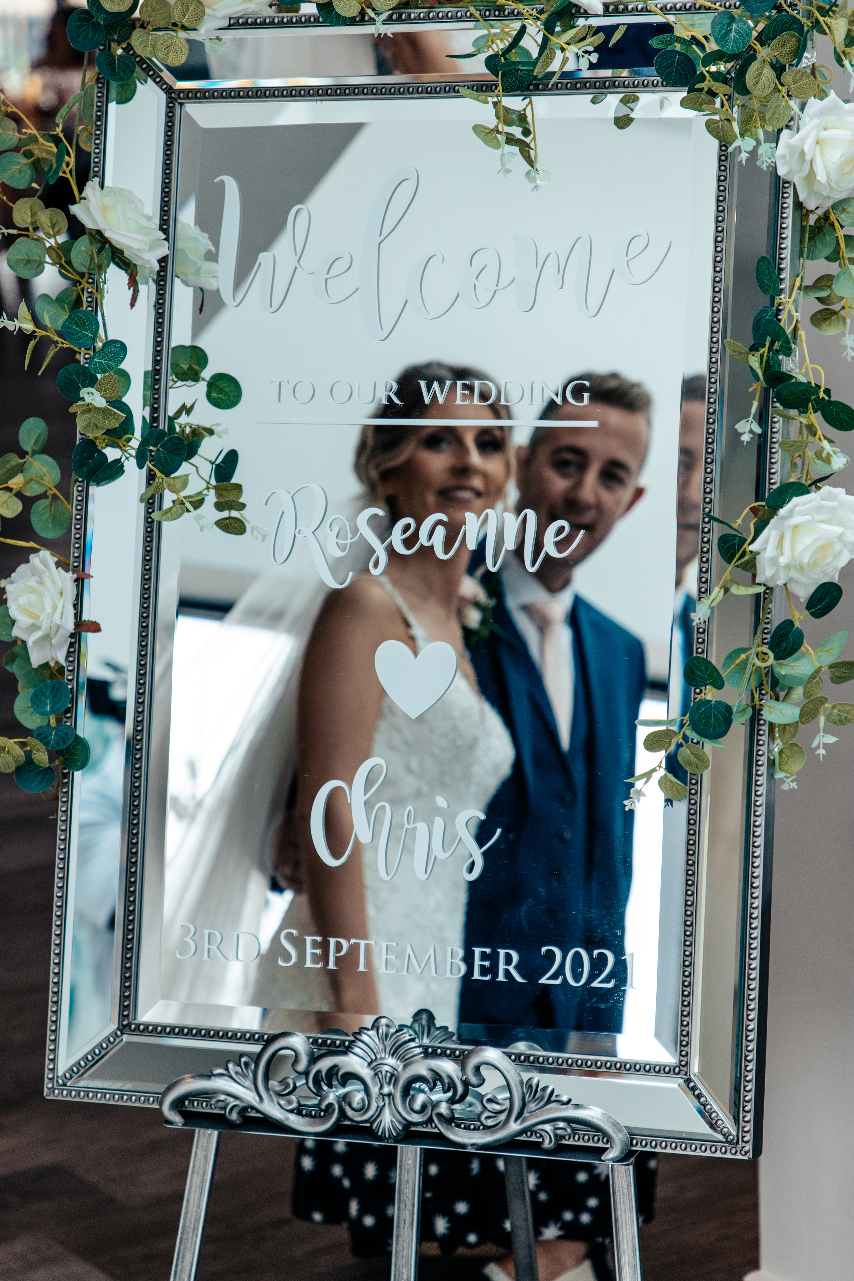 Bride and Groom looking into the mirror 