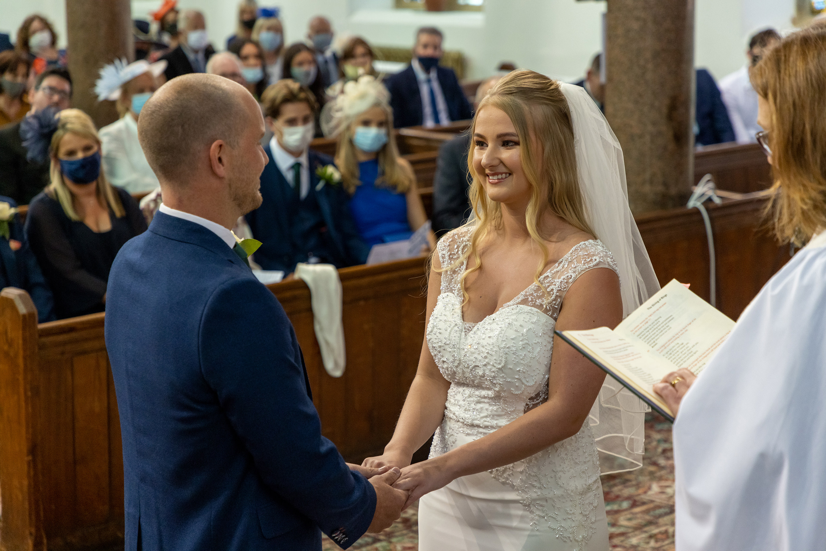 the bride and groom in the church