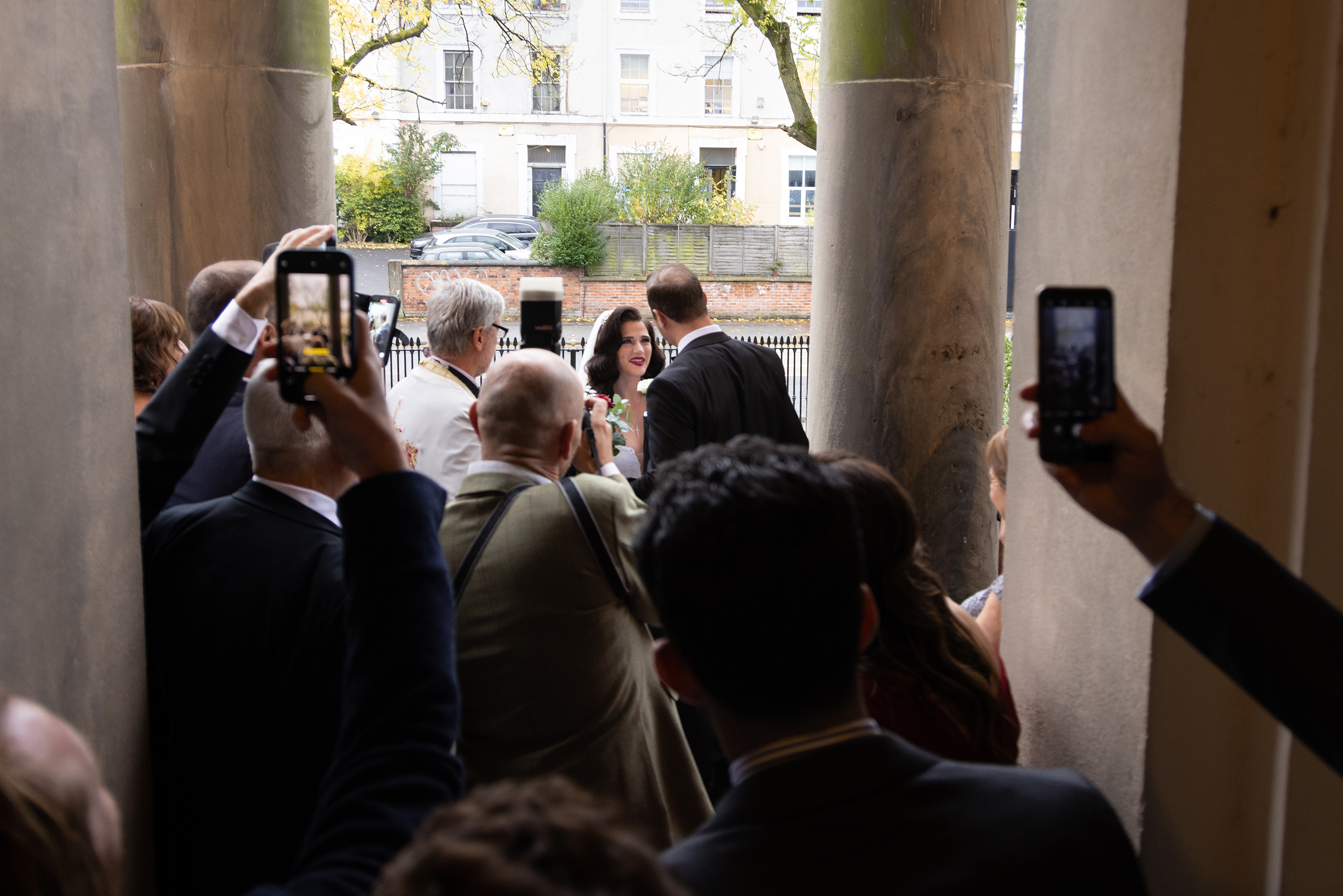  catching a glimpse of the bride through the crowd