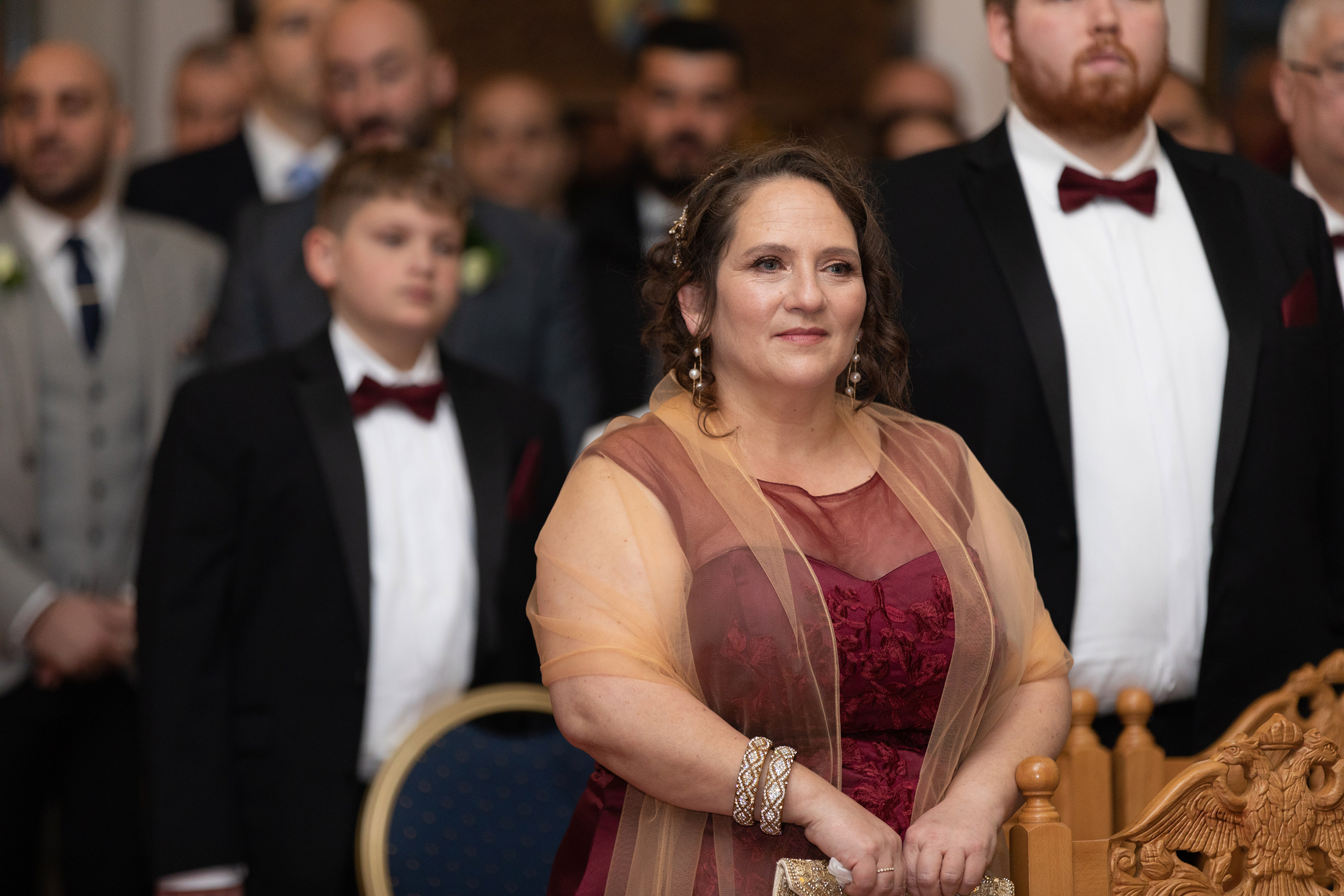  the brides mother looks on