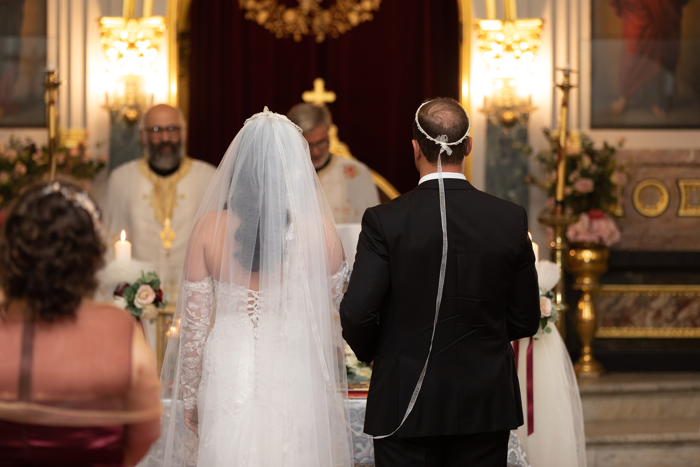  the couple are joined in their wedding crowns