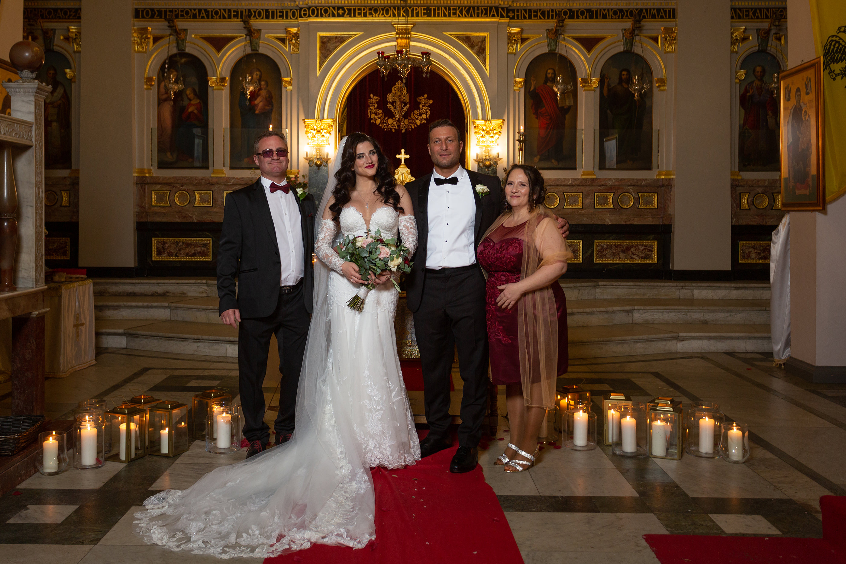  the bride and groom with the bride's parents