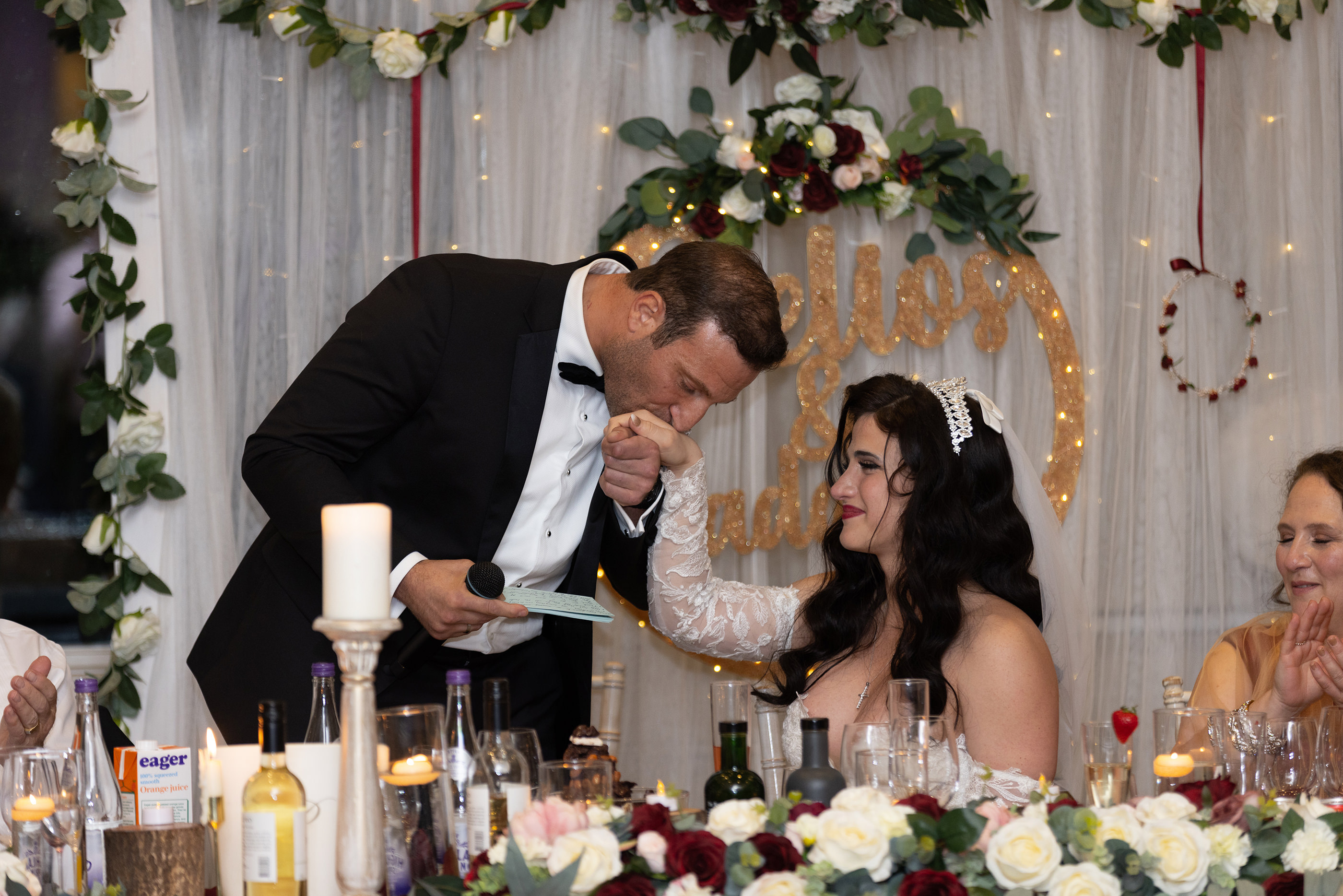  the groom kisses his wife's hand