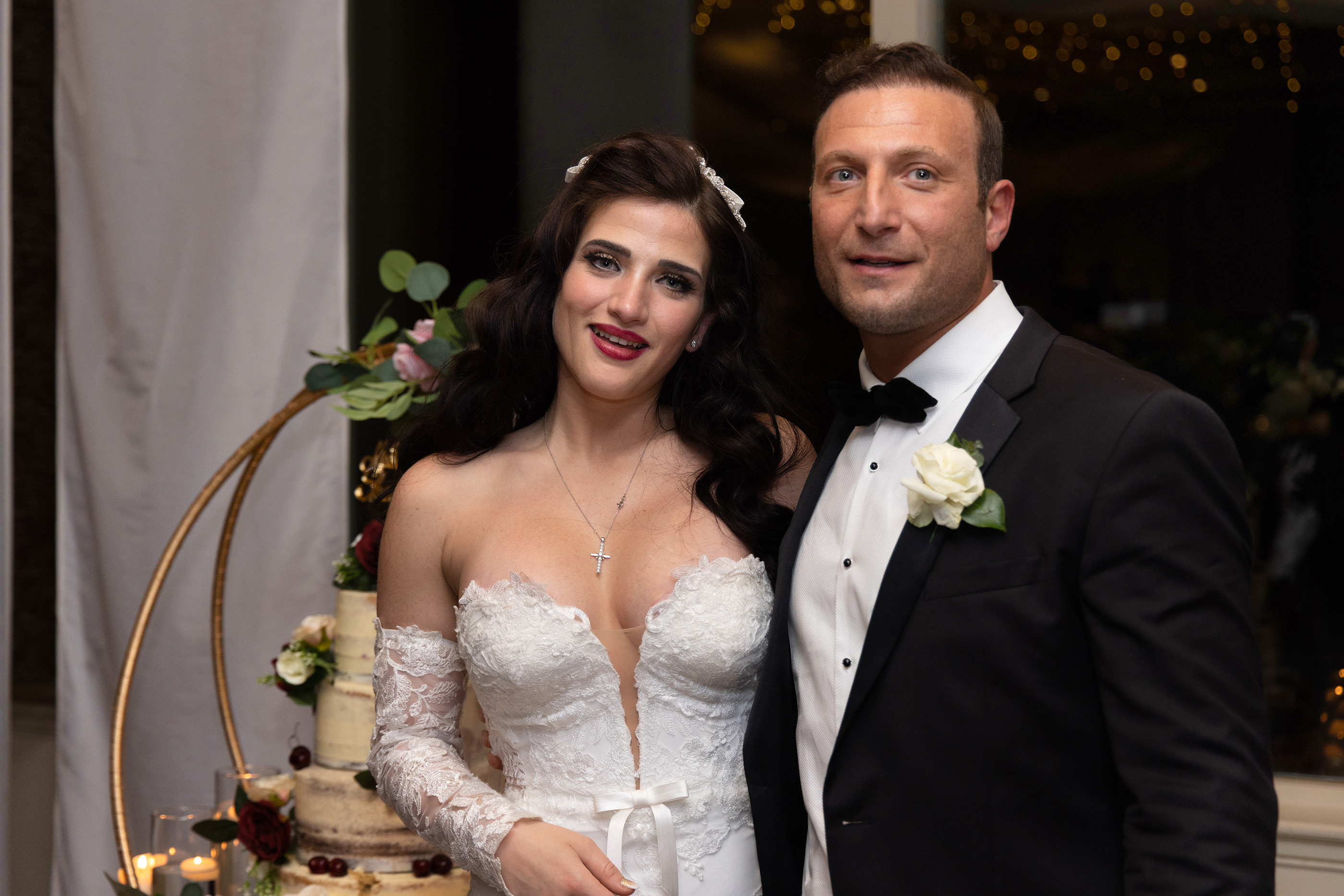  the bride and groom cut the cake