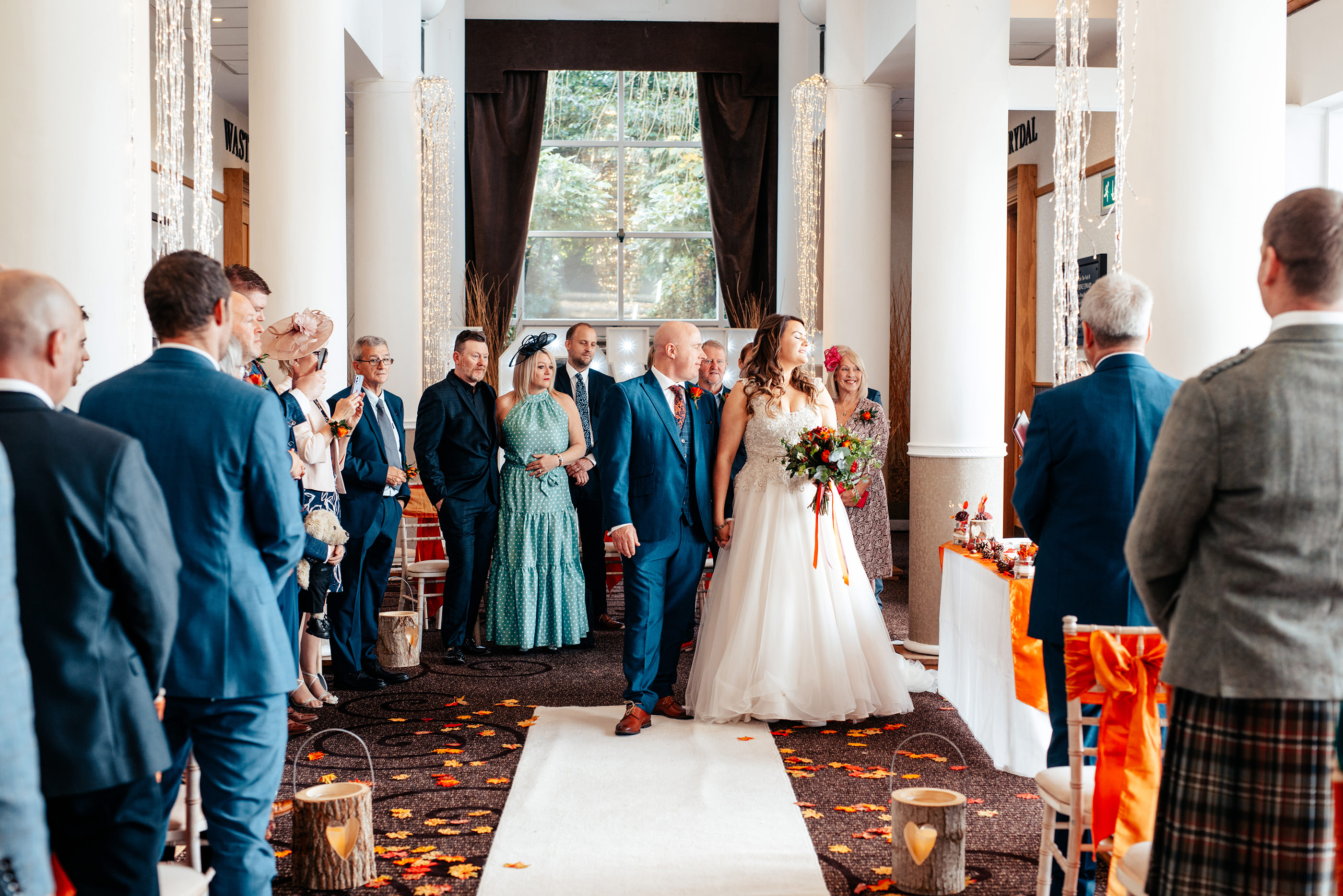  the bride and groom walk down as a married couple
