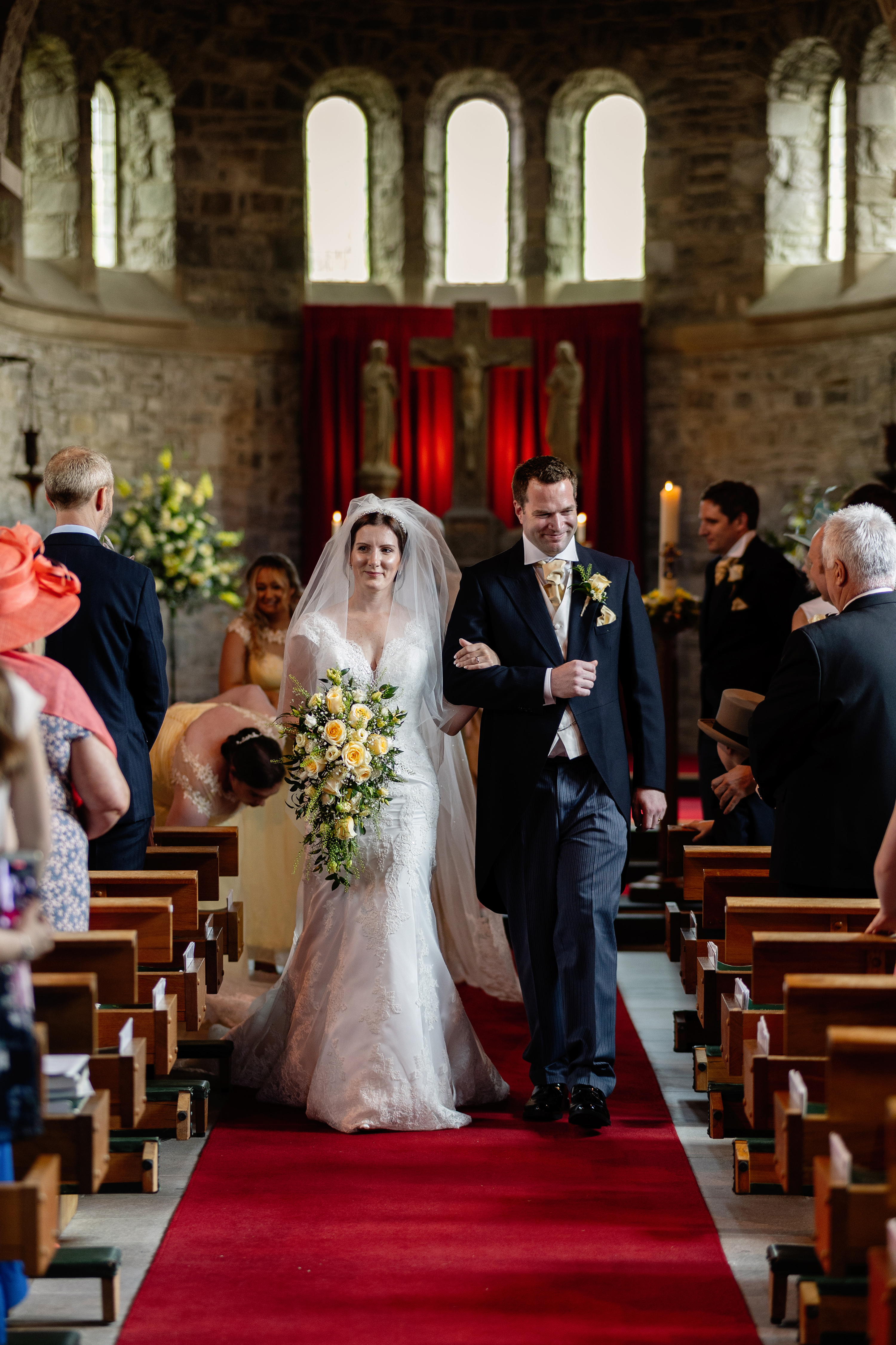 Bride and Groom walk down the aisle now husband and wife 