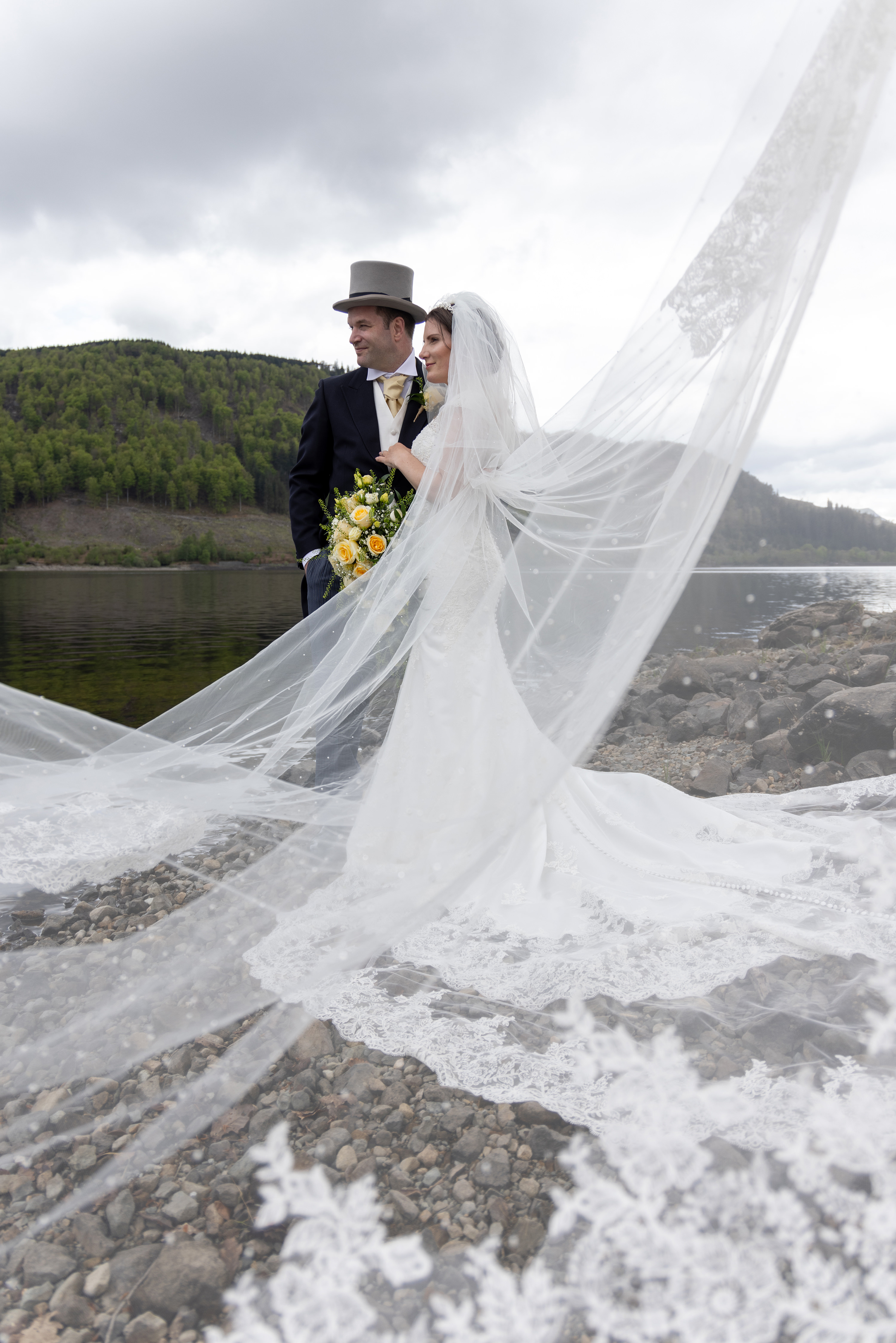 The bride and groom with the wedding dress
