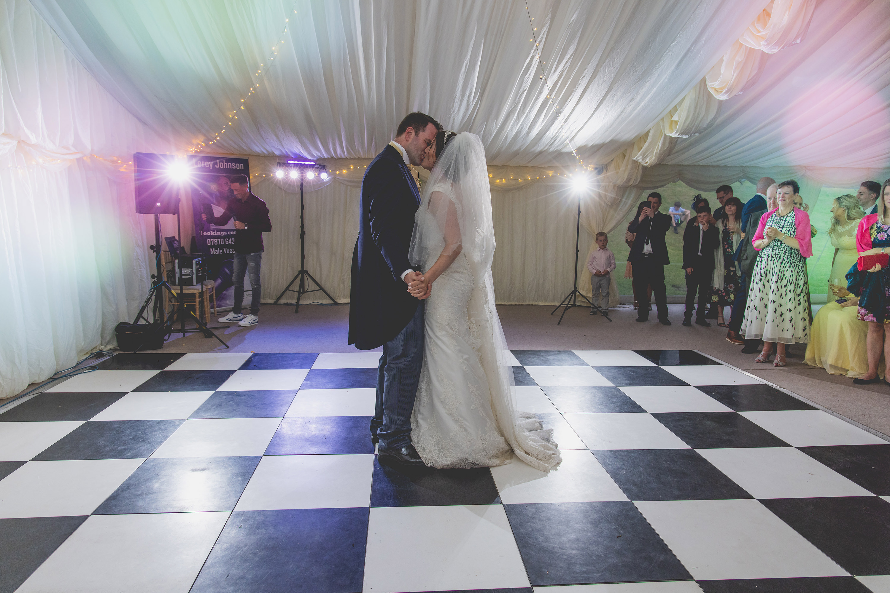 The bride and groom start their first dance 
