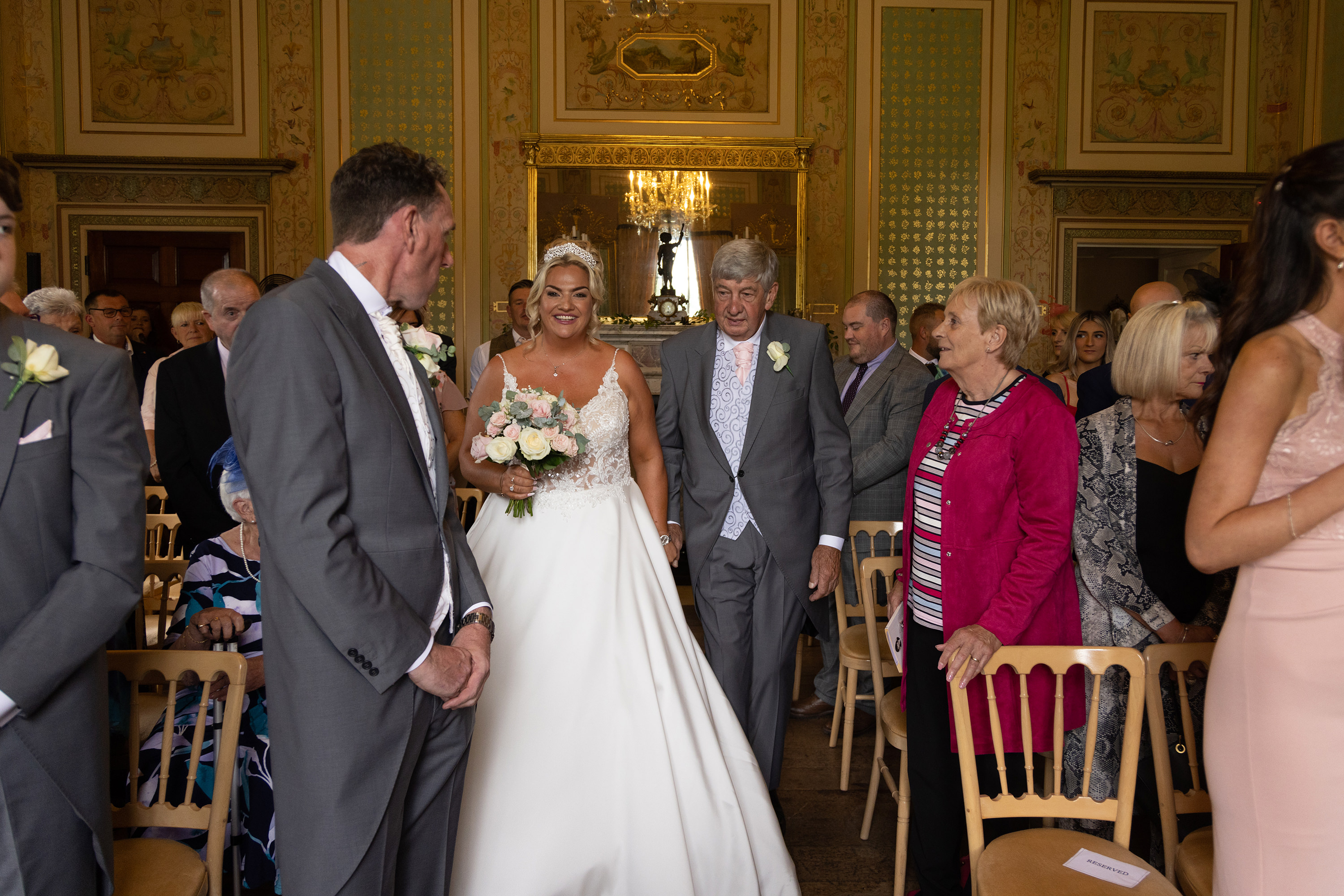 Amy walks down the aisle with her father