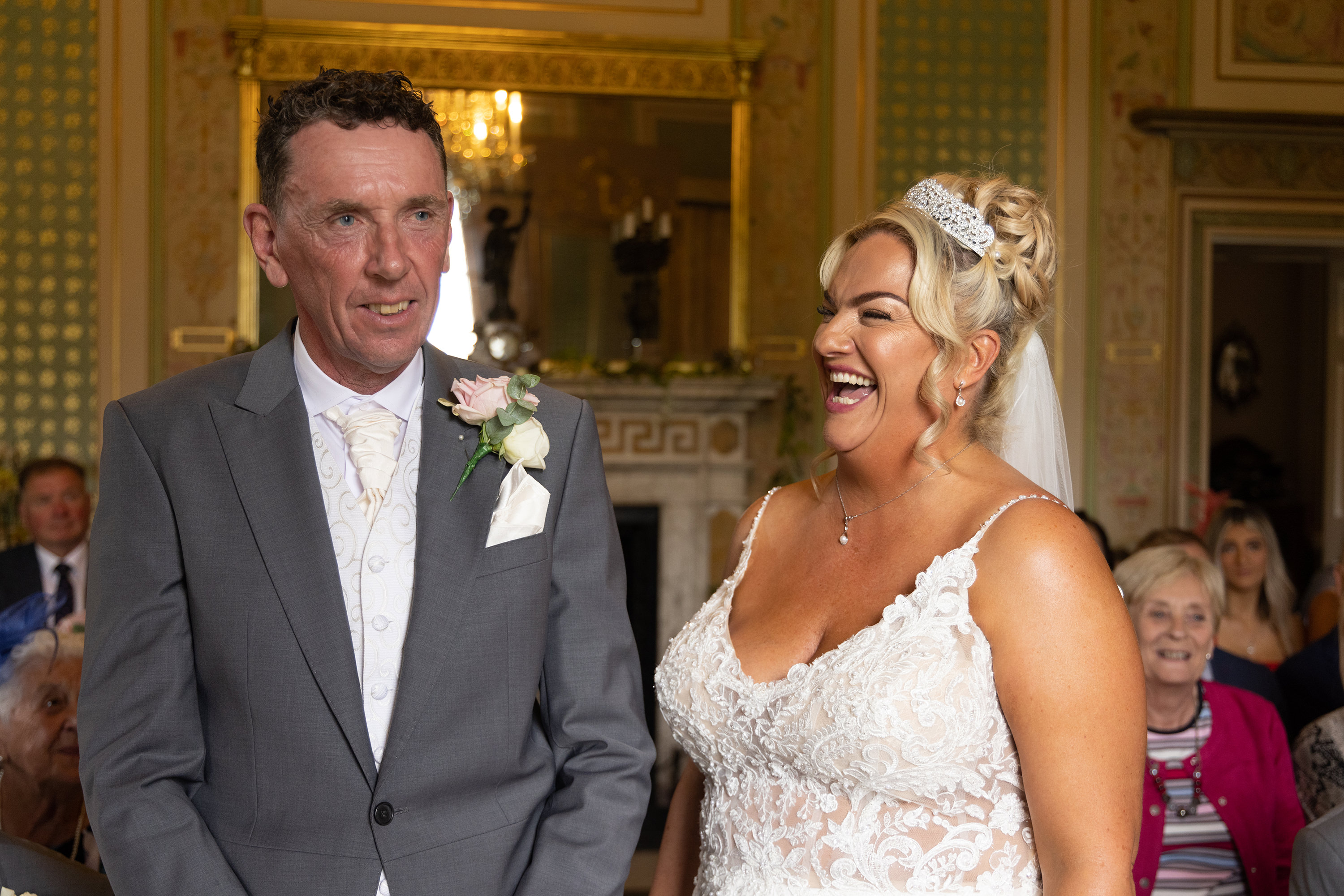 Amy and Tony laughing during the wedding ceremony 