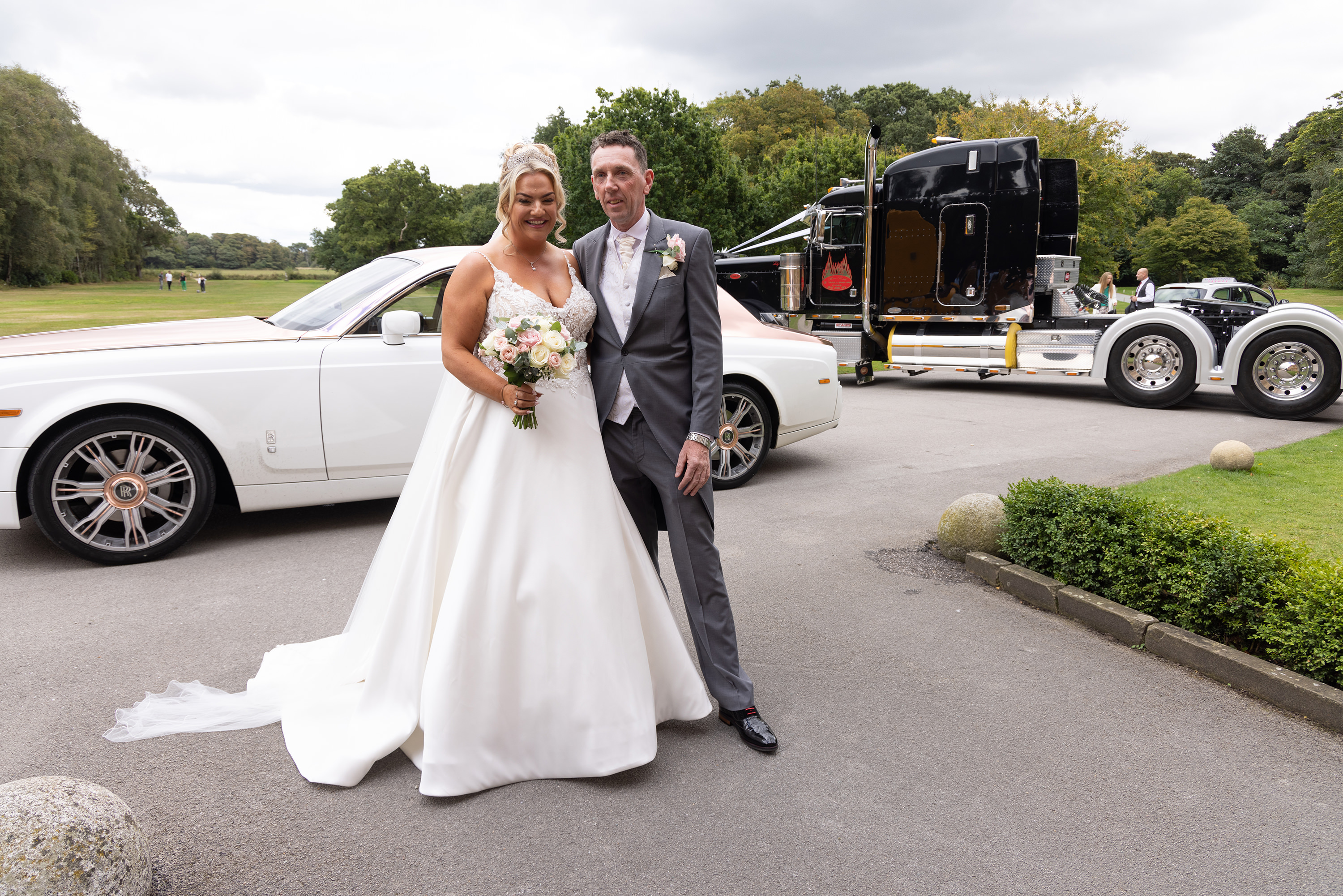Amy and Tony pose for a photo with the Rolls-Royce