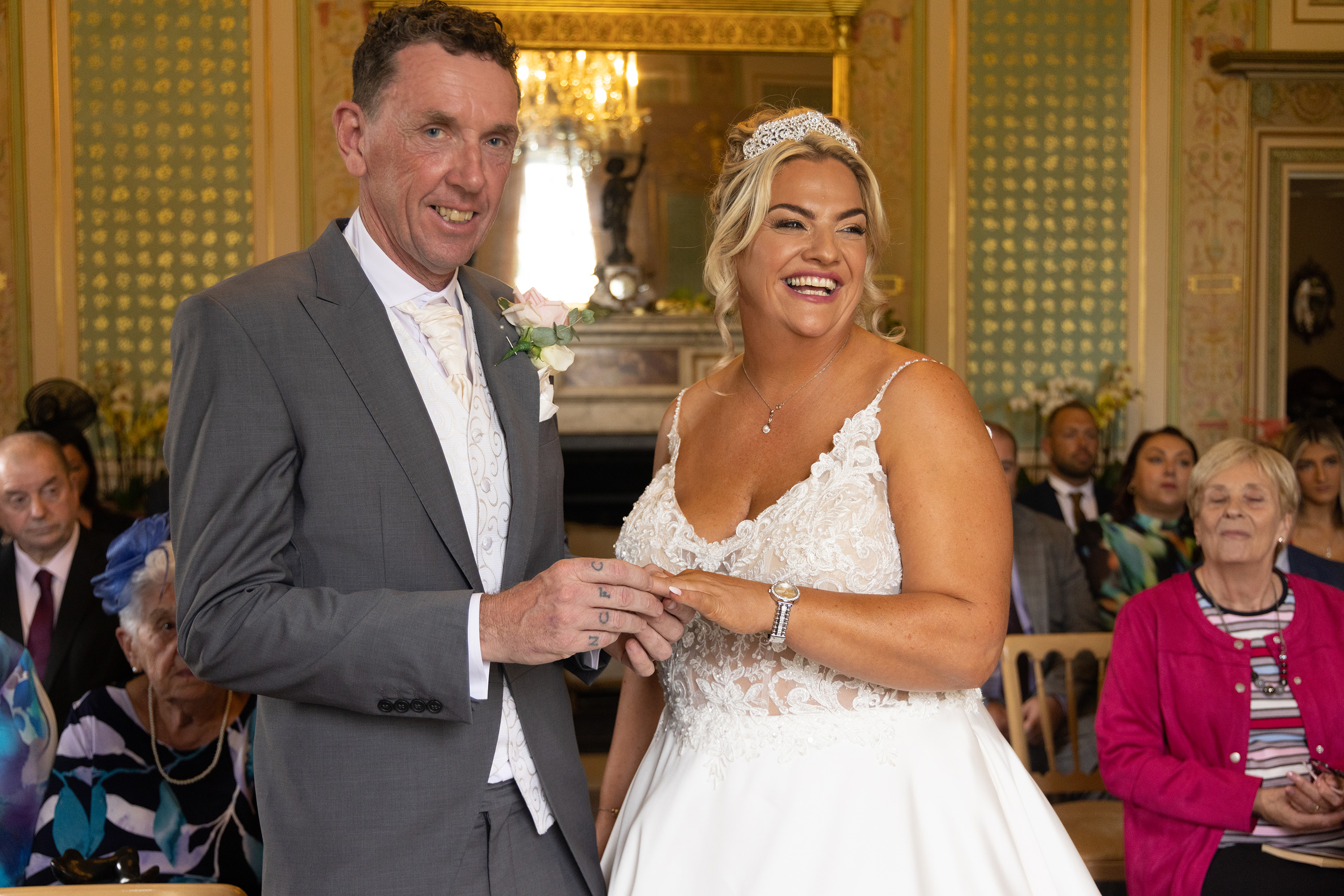 Tony puts Amy's wedding ring on her finger 
