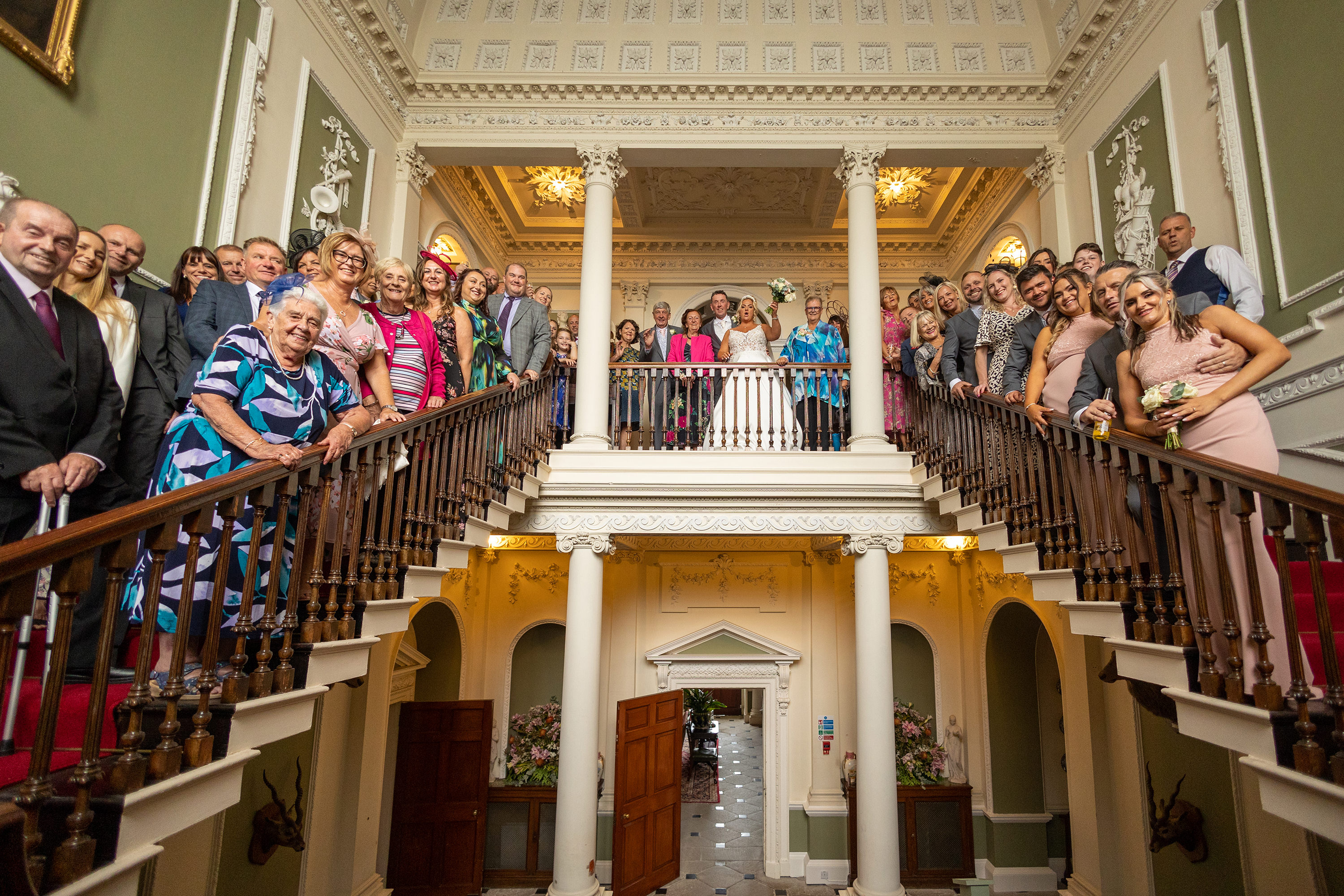 The bride and groom and their wedding guests at Lytham Hall 