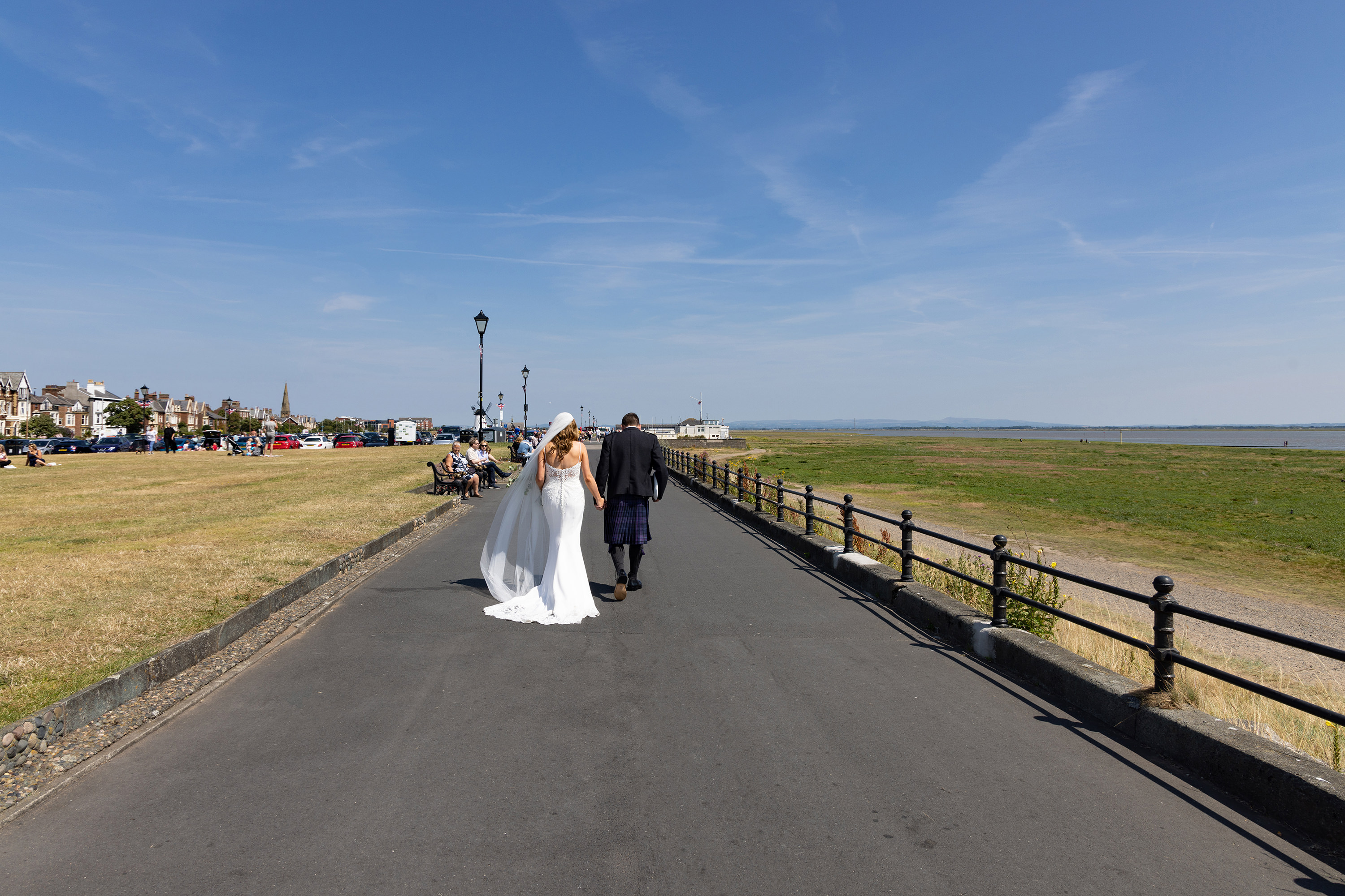 The bride and groom have a walk along Lytham Promenade