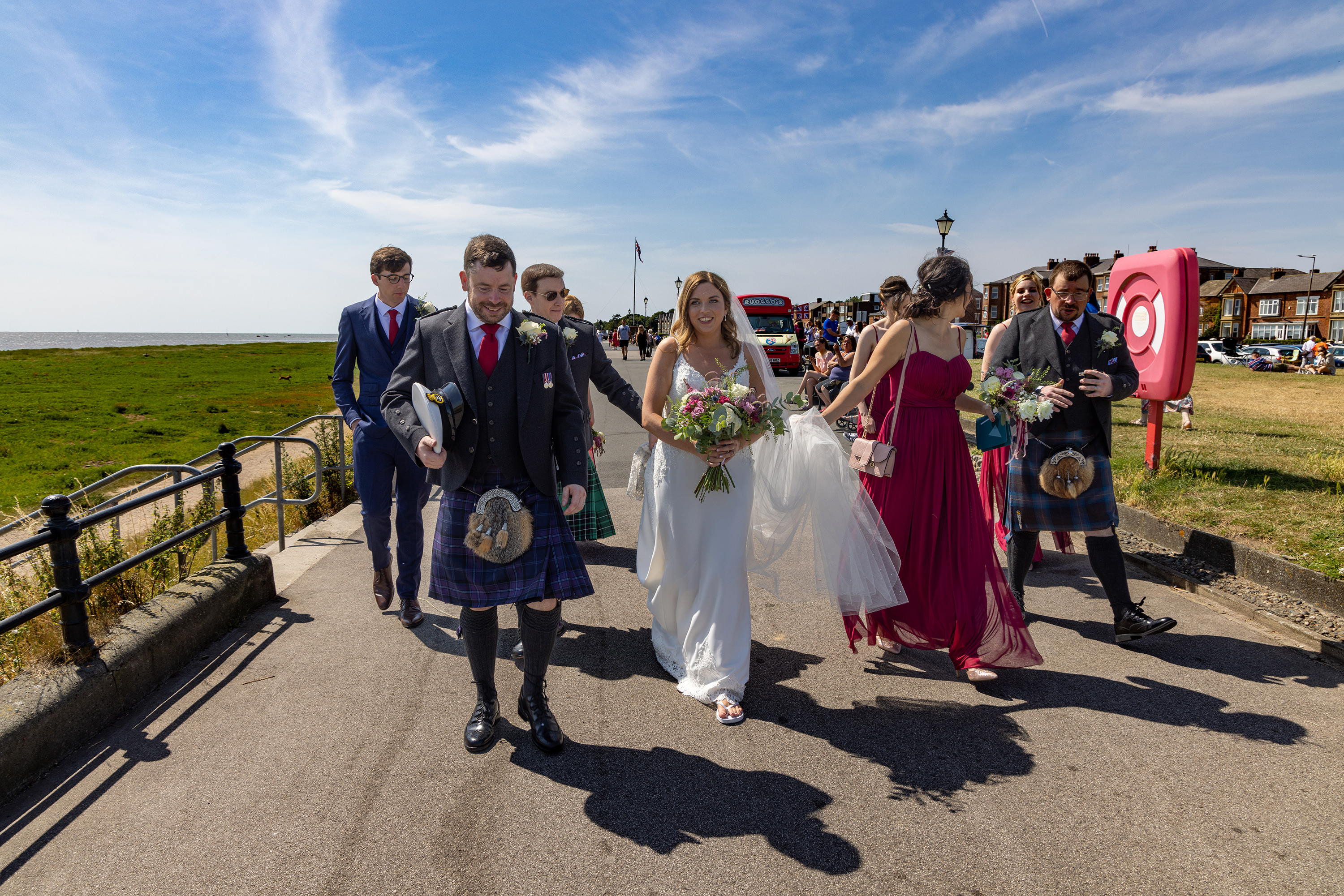 The bride and groom with the groomsmen and bridesmaids in Lytham 
