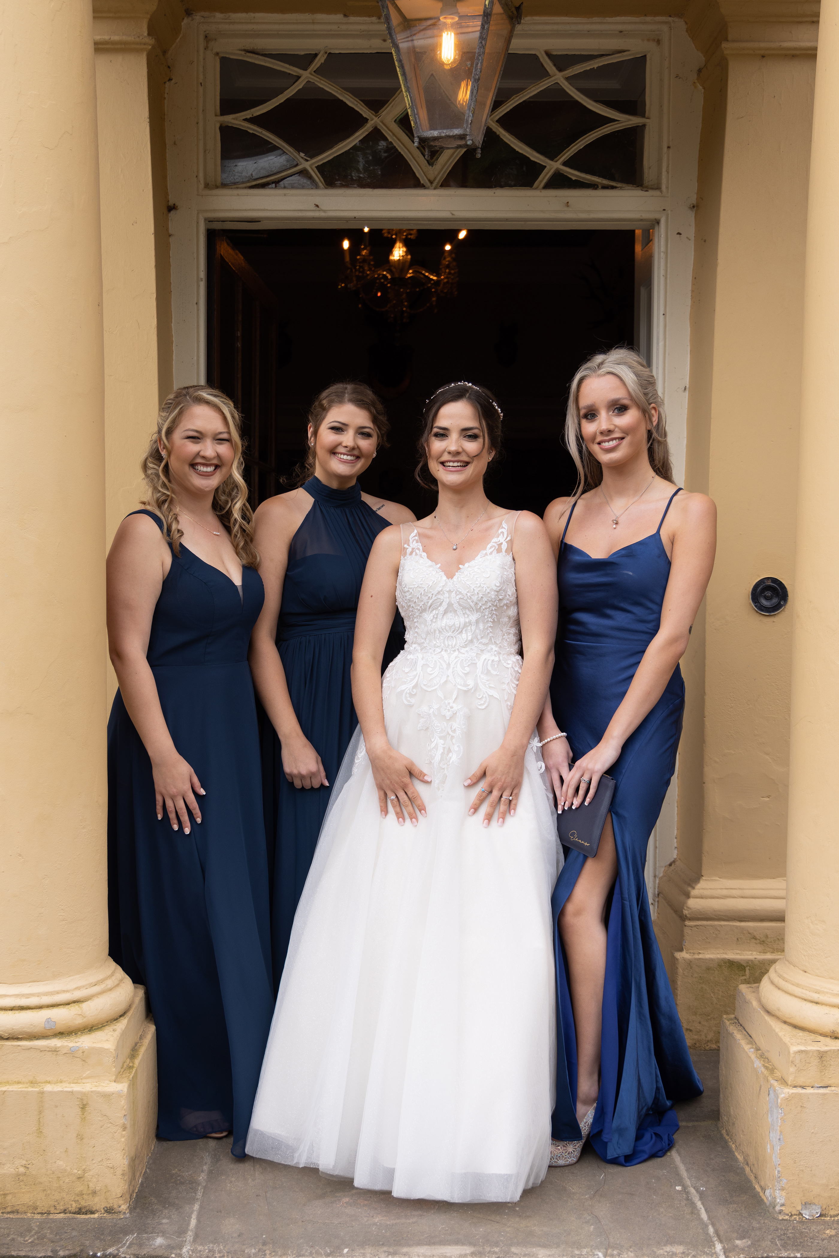 The bride and her bridesmaids in their dresses 