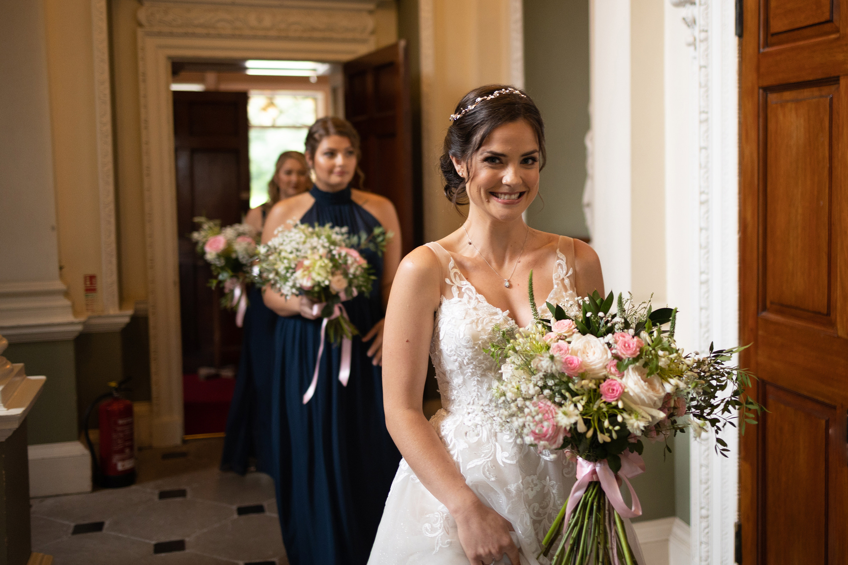 The bride and her bridesmaids entering Lytham Hall 