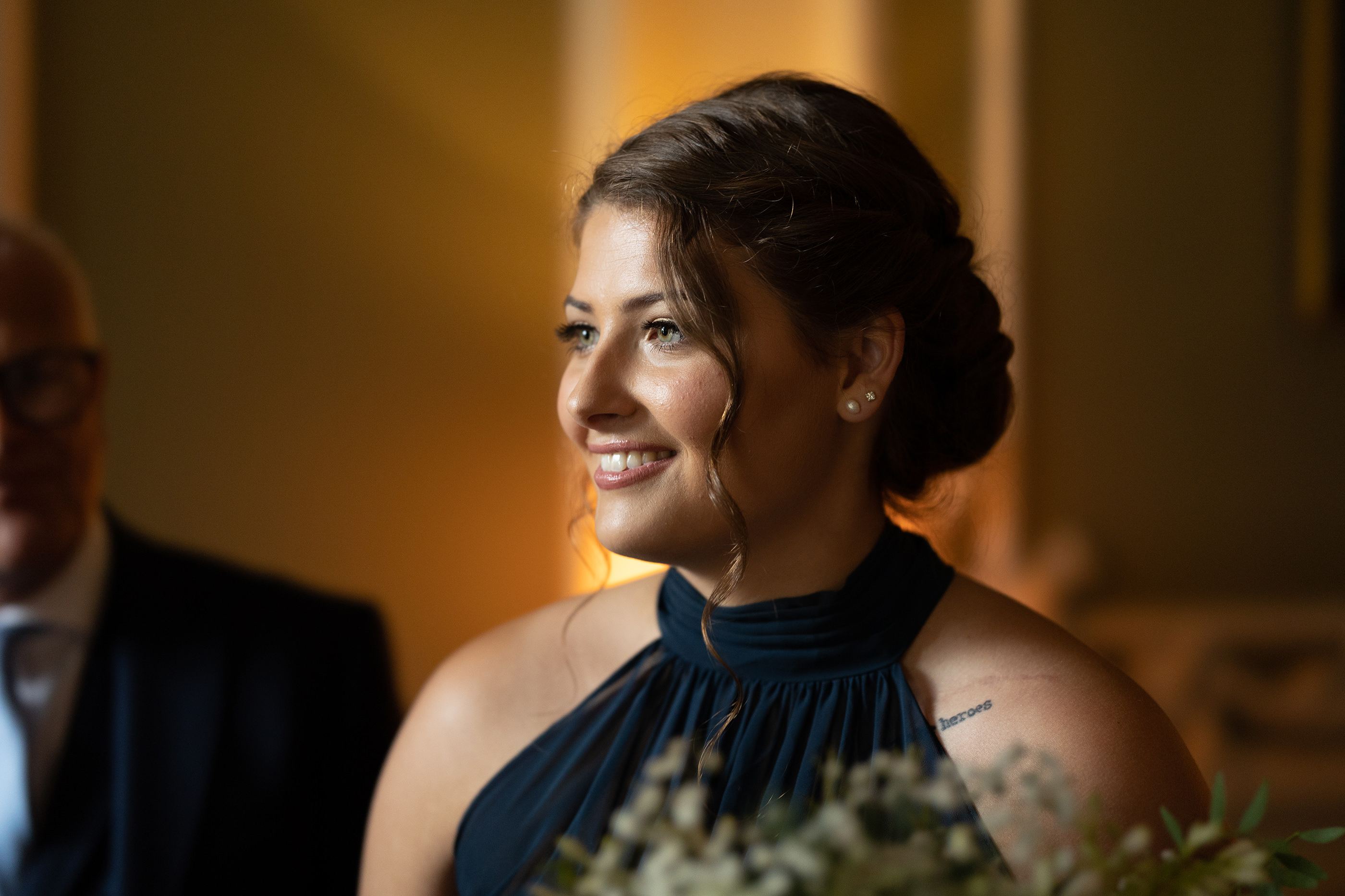The bridesmaid looking happy 