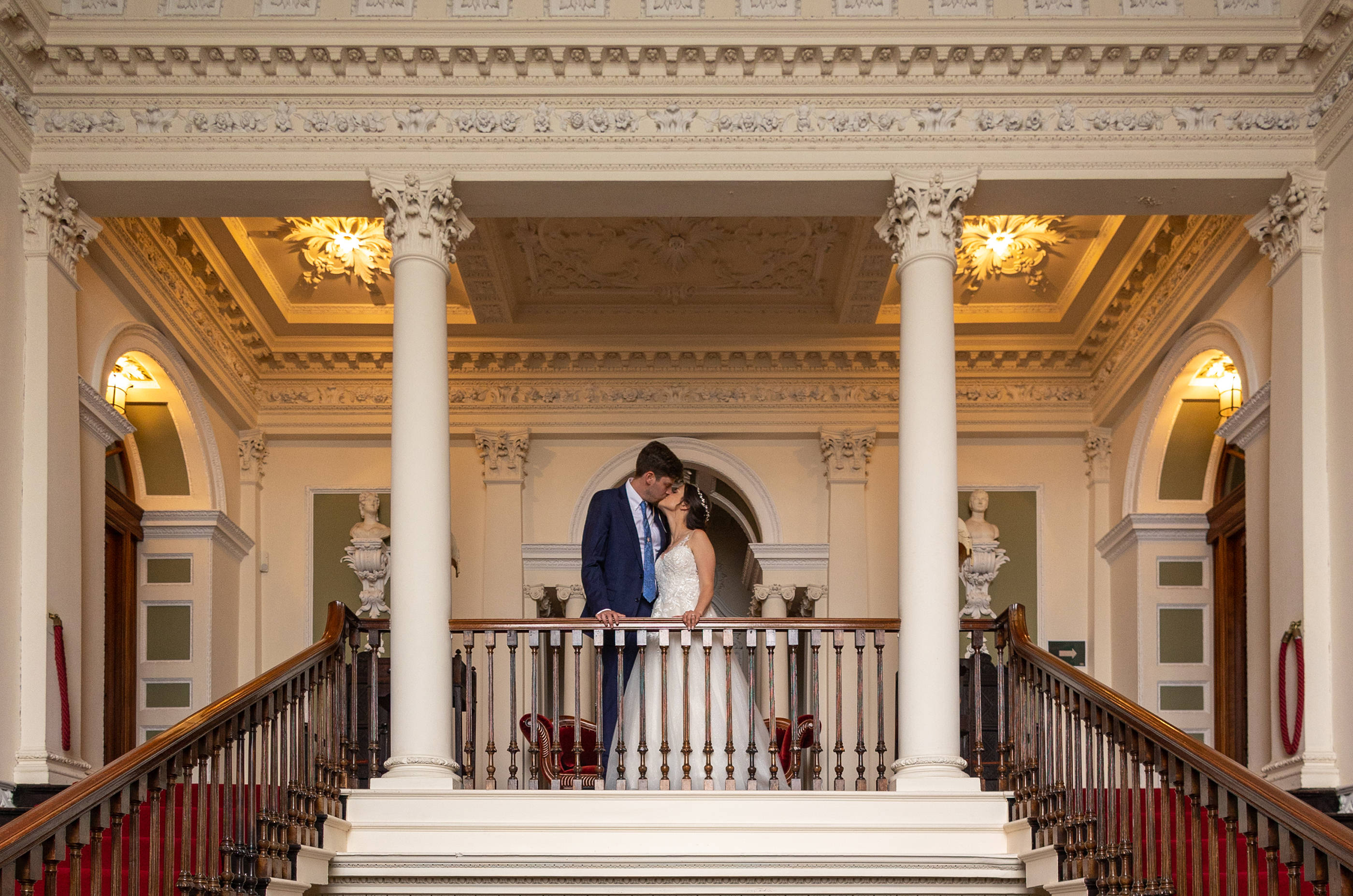 The bride and groom have a moment and kiss each other 