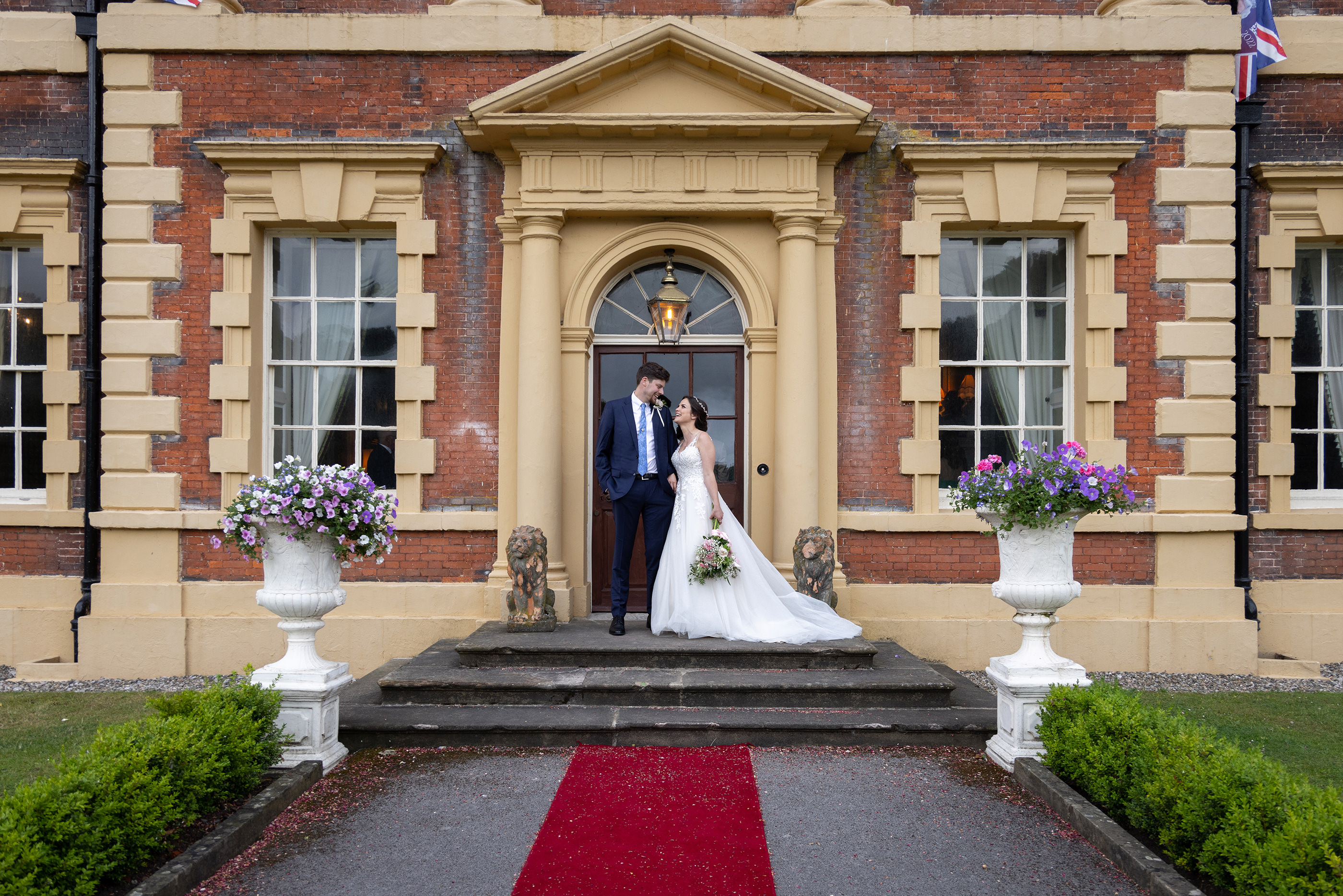 The bride and groom at the main door to Lytham Hall 