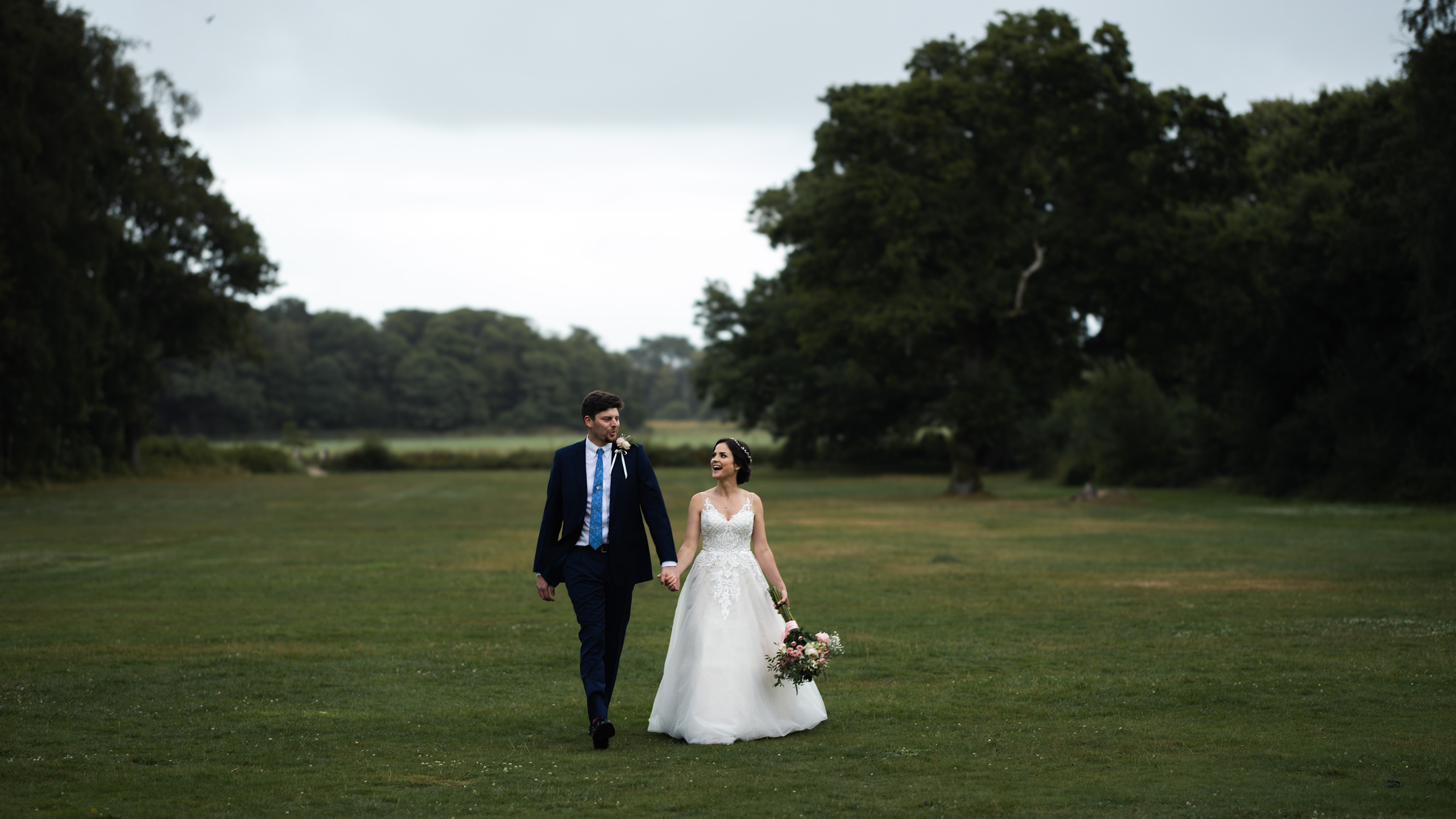 Chelsea and James laughing as they're walking 