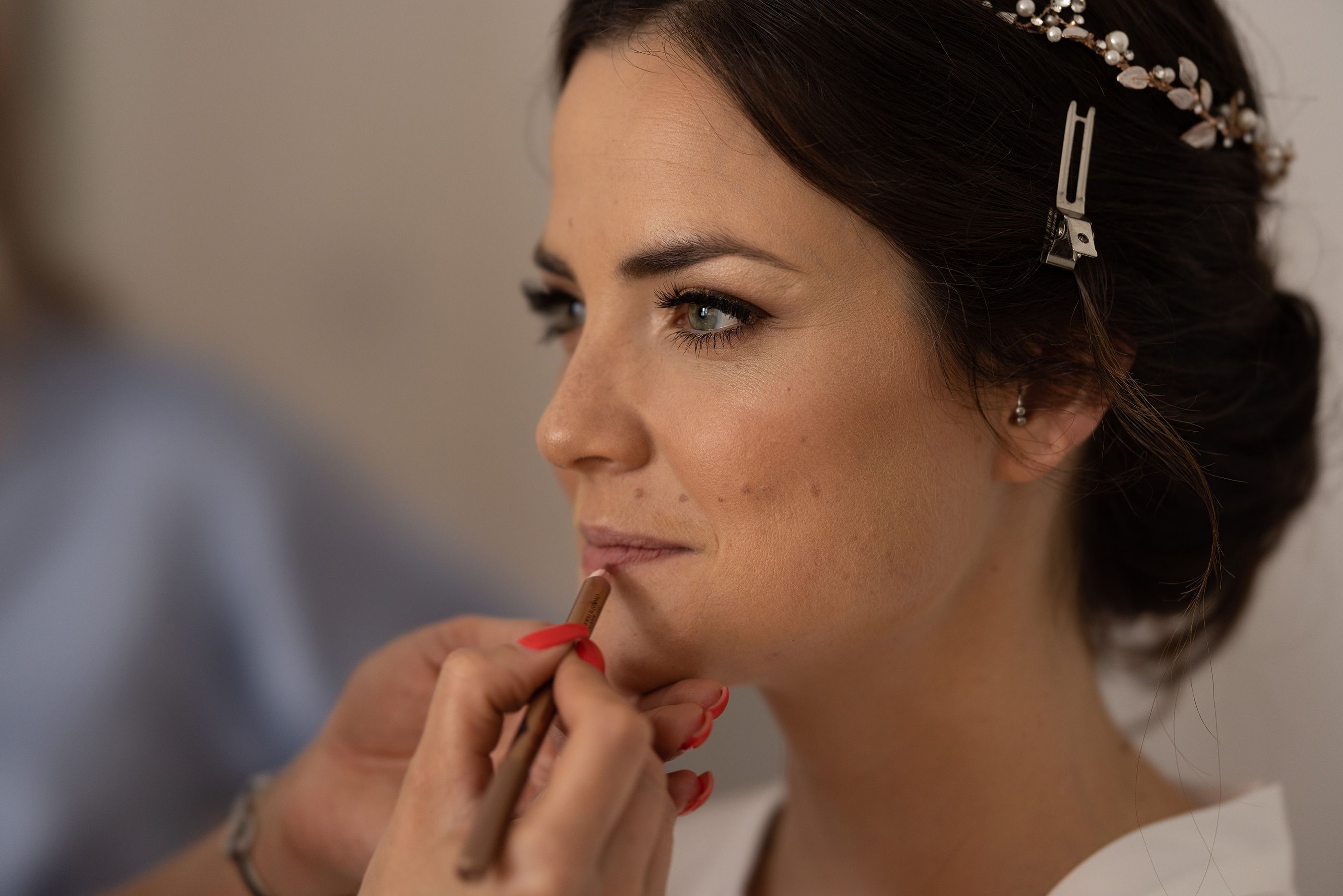 The Bride Chelsea having some lipstick put on 