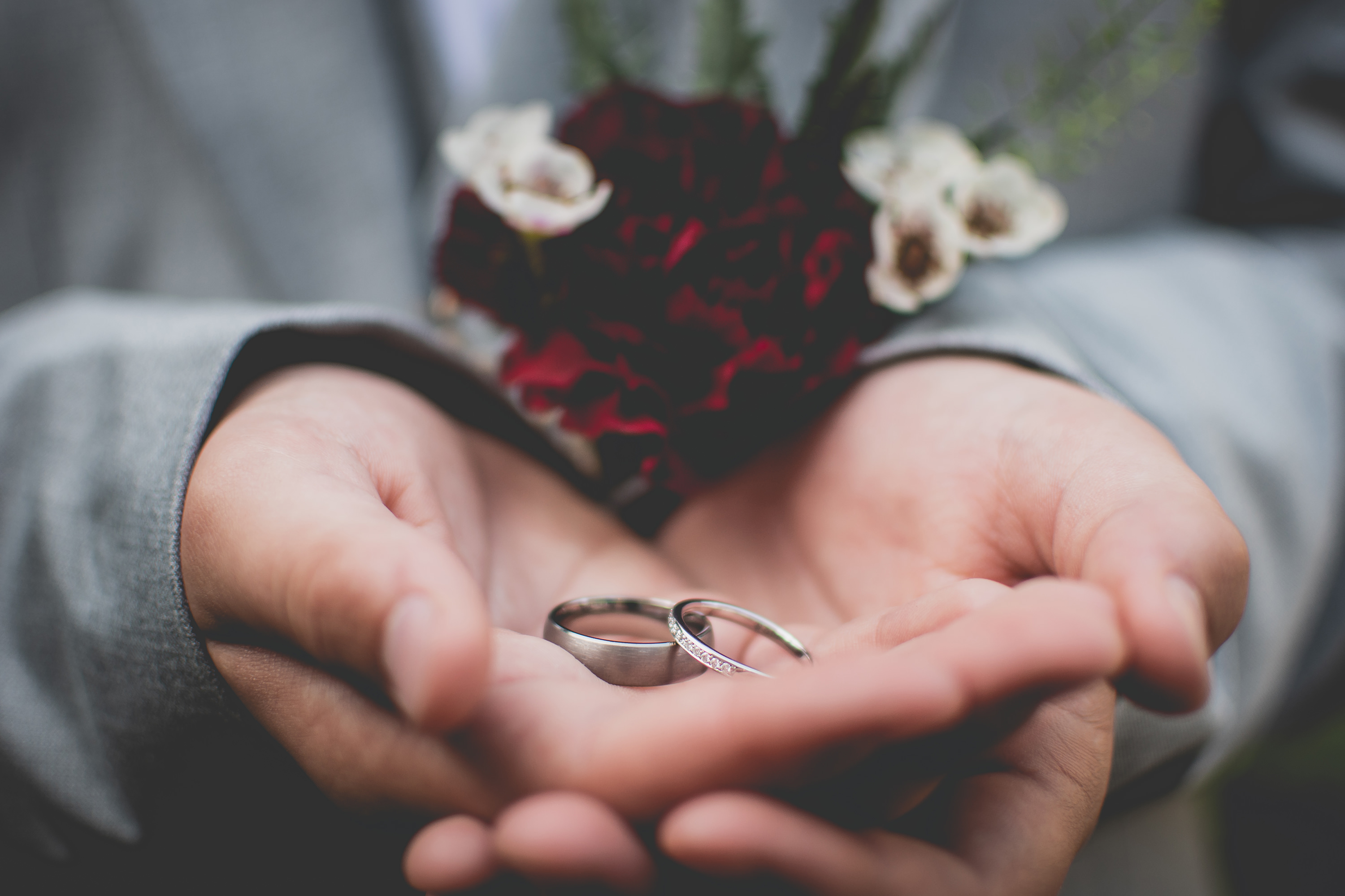 The best man holding the wedding rings 