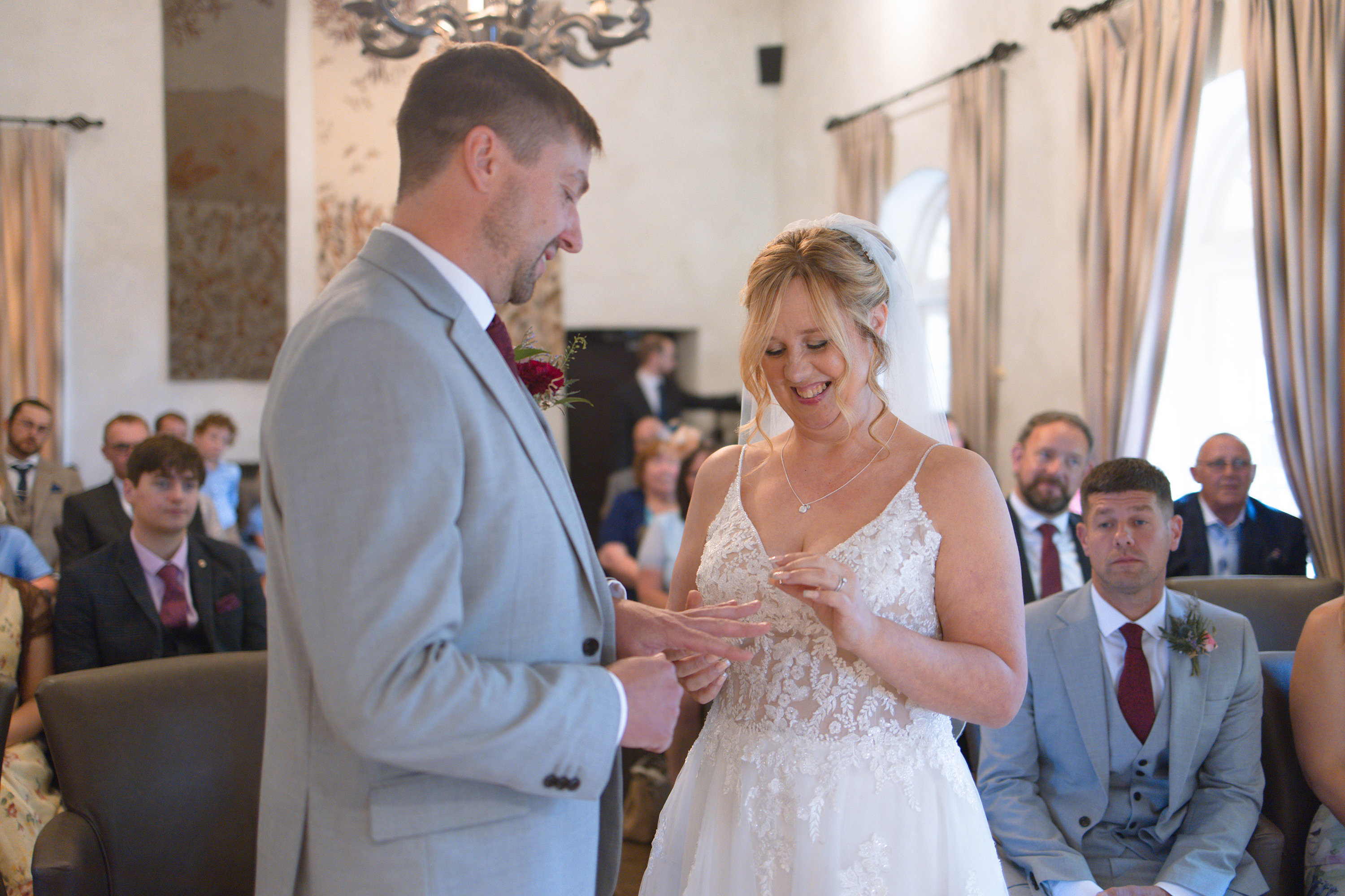 Louise puts marks wedding ring on his finger 