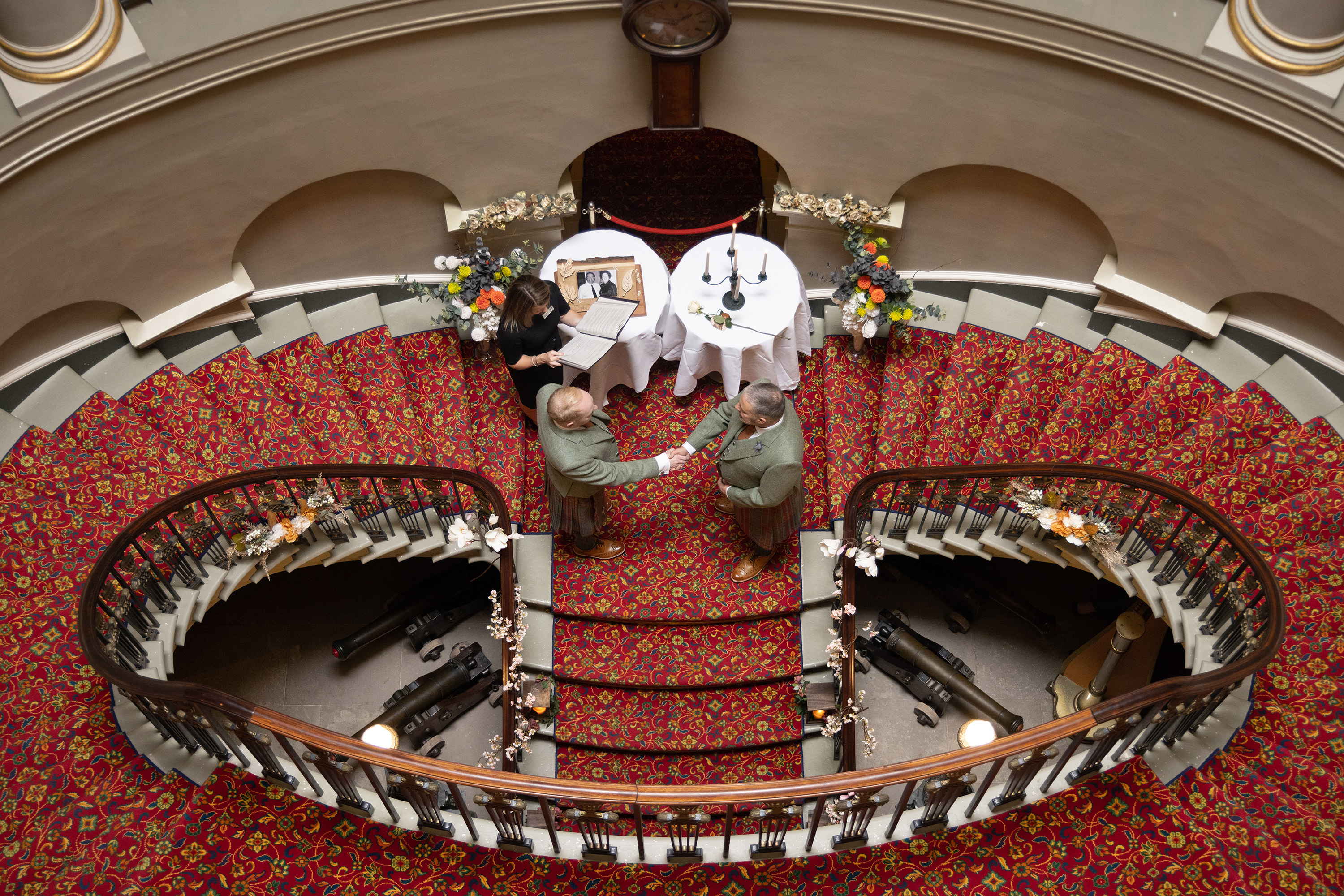 Robert and Andrew hold hands whilst exchanging their wedding vows 
