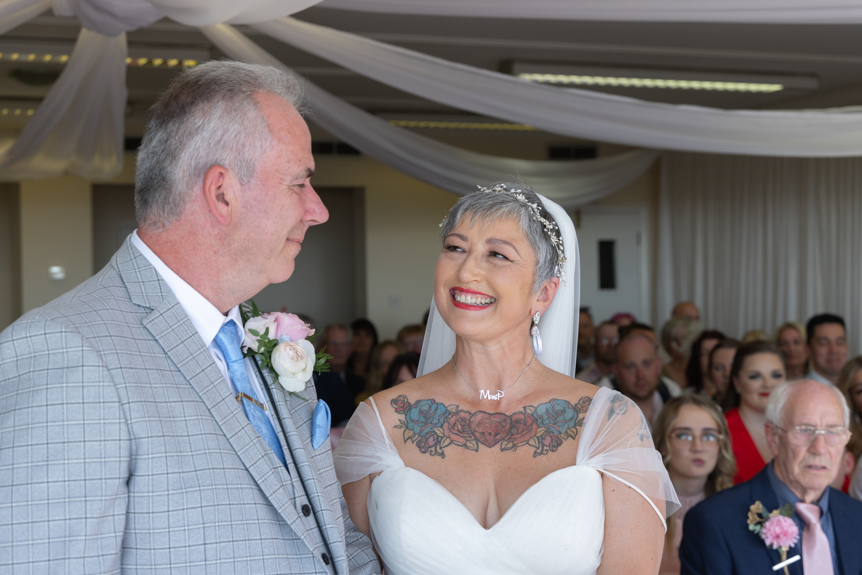 Caroline smiles at Peter during the wedding 