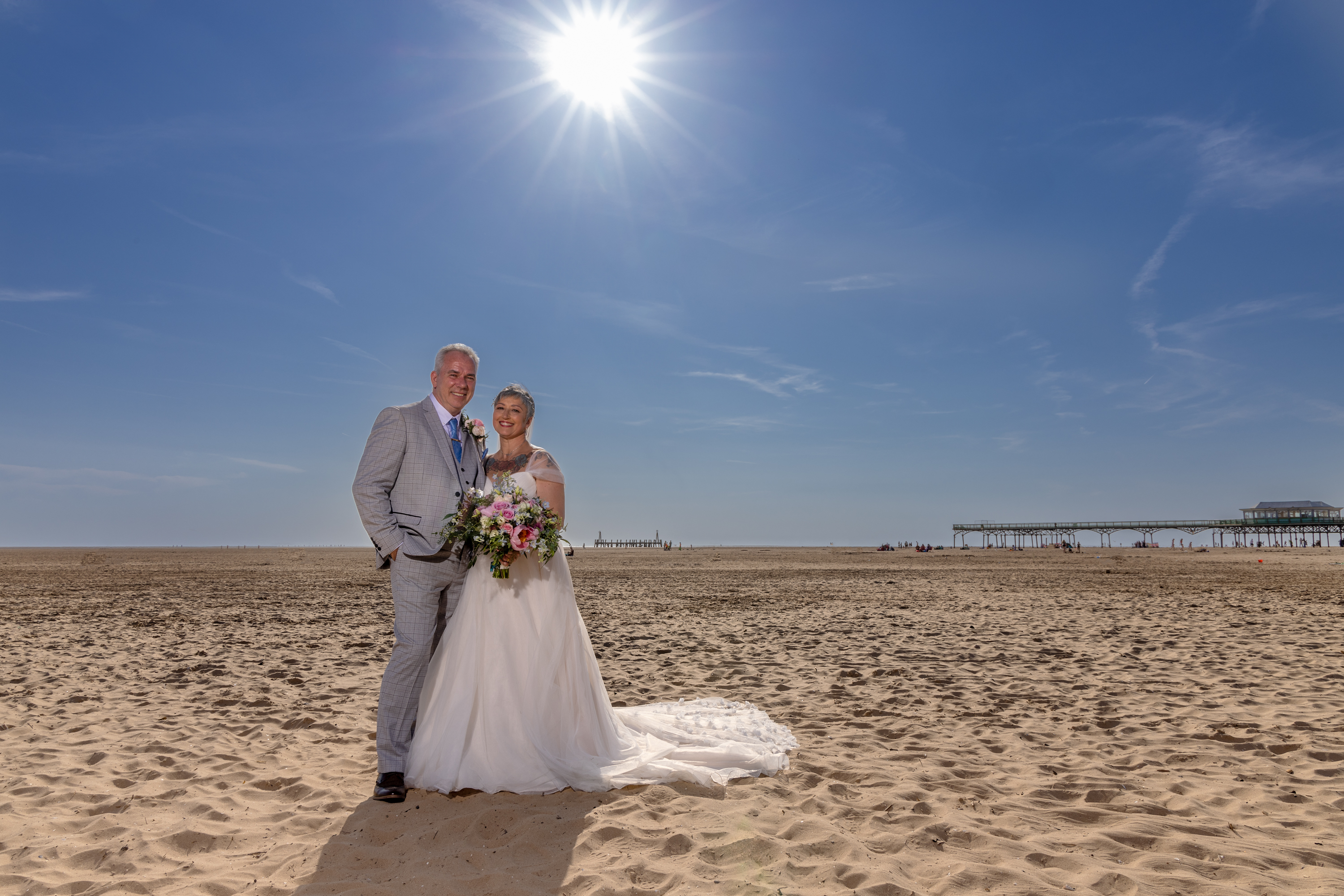 Caroline and Peter go down onto Saint Ann's beach for their wedding photos 