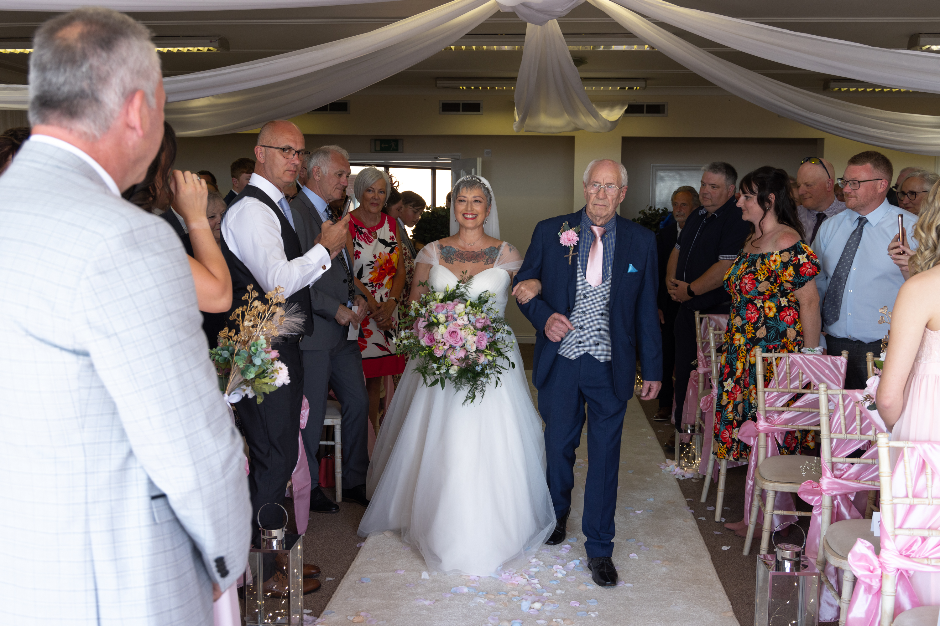 Caroline's father walks her down the aisle at the dalmeny hotel 
