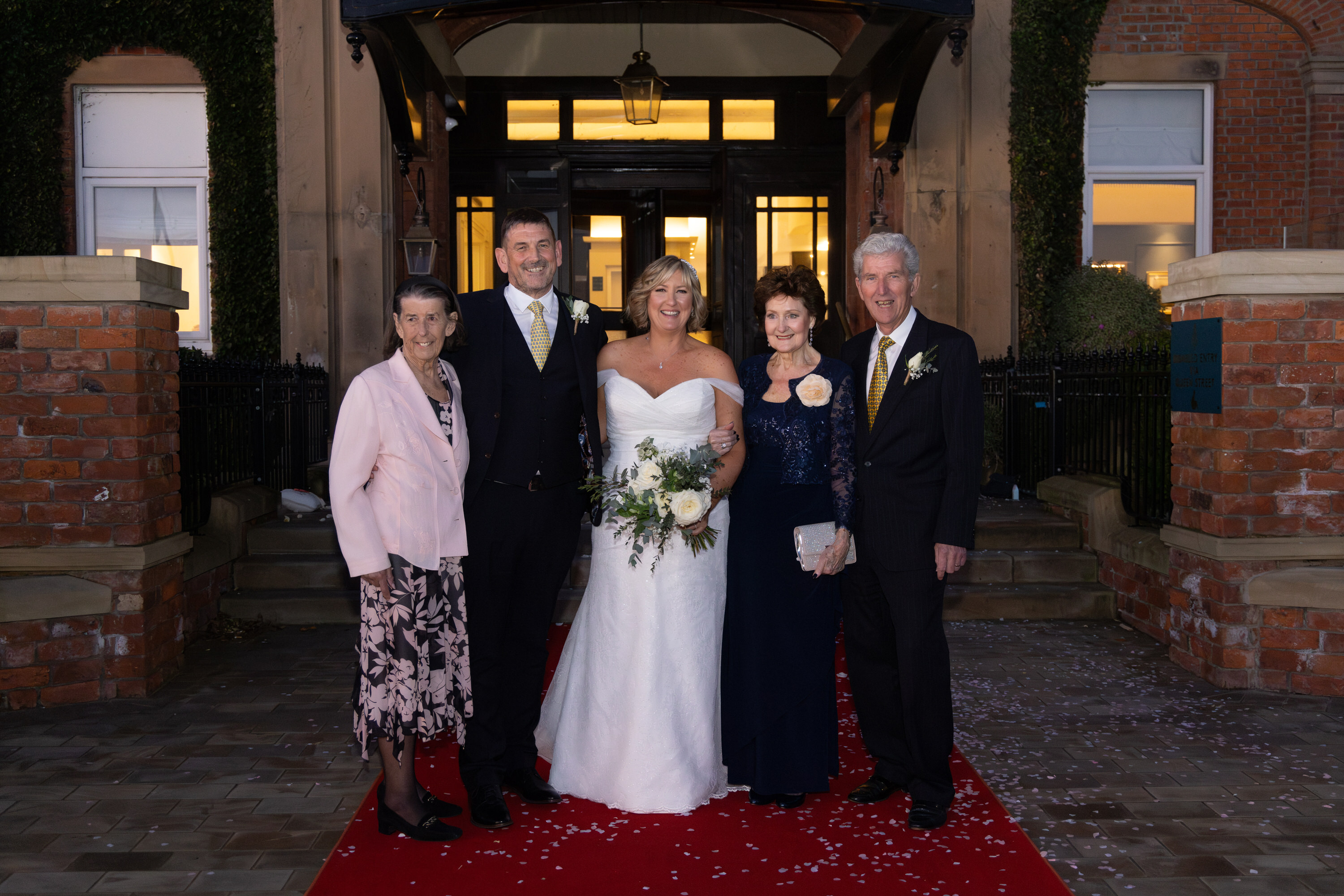 The bride and groom with their parents 