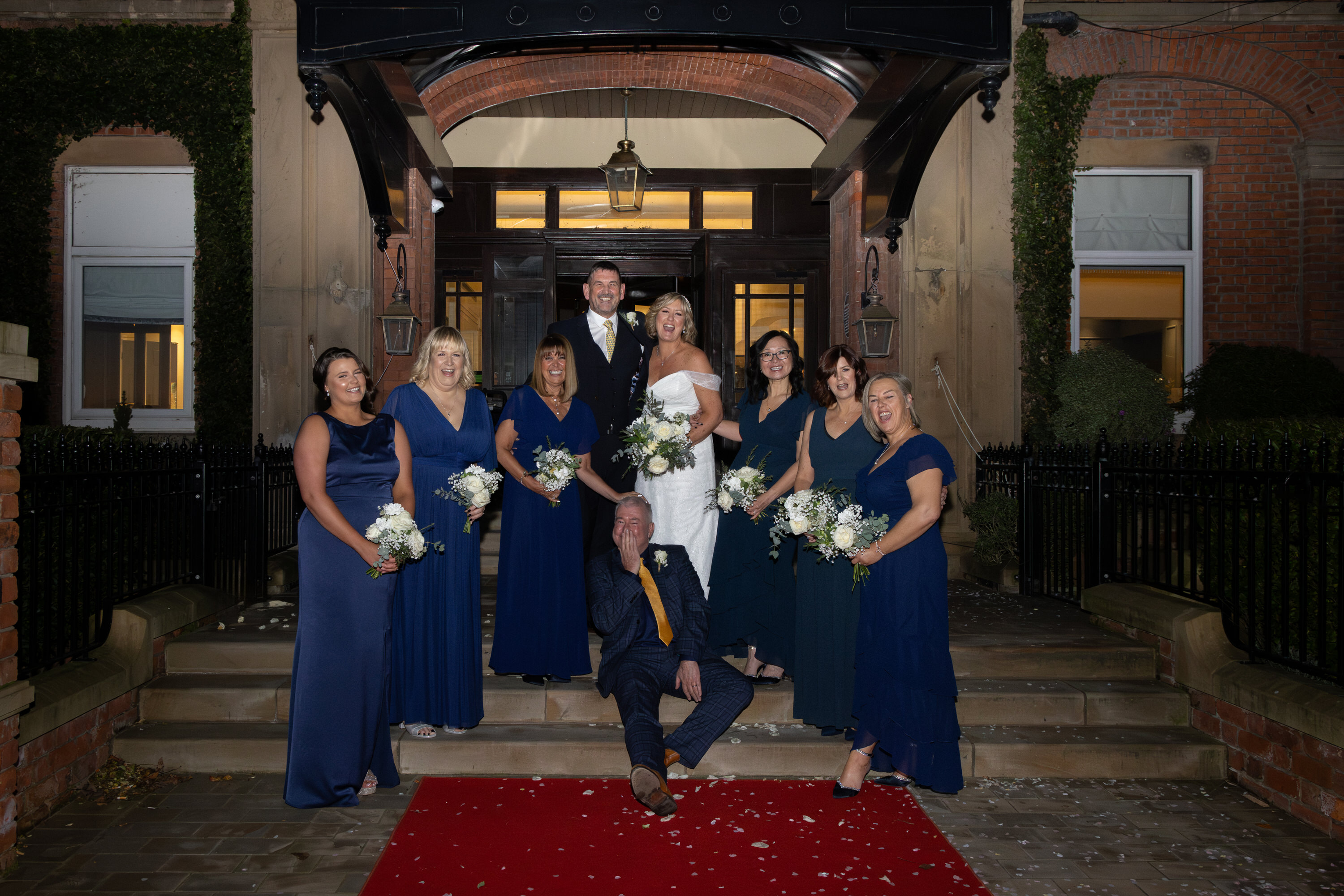 The bride and groom with the bridesmaids