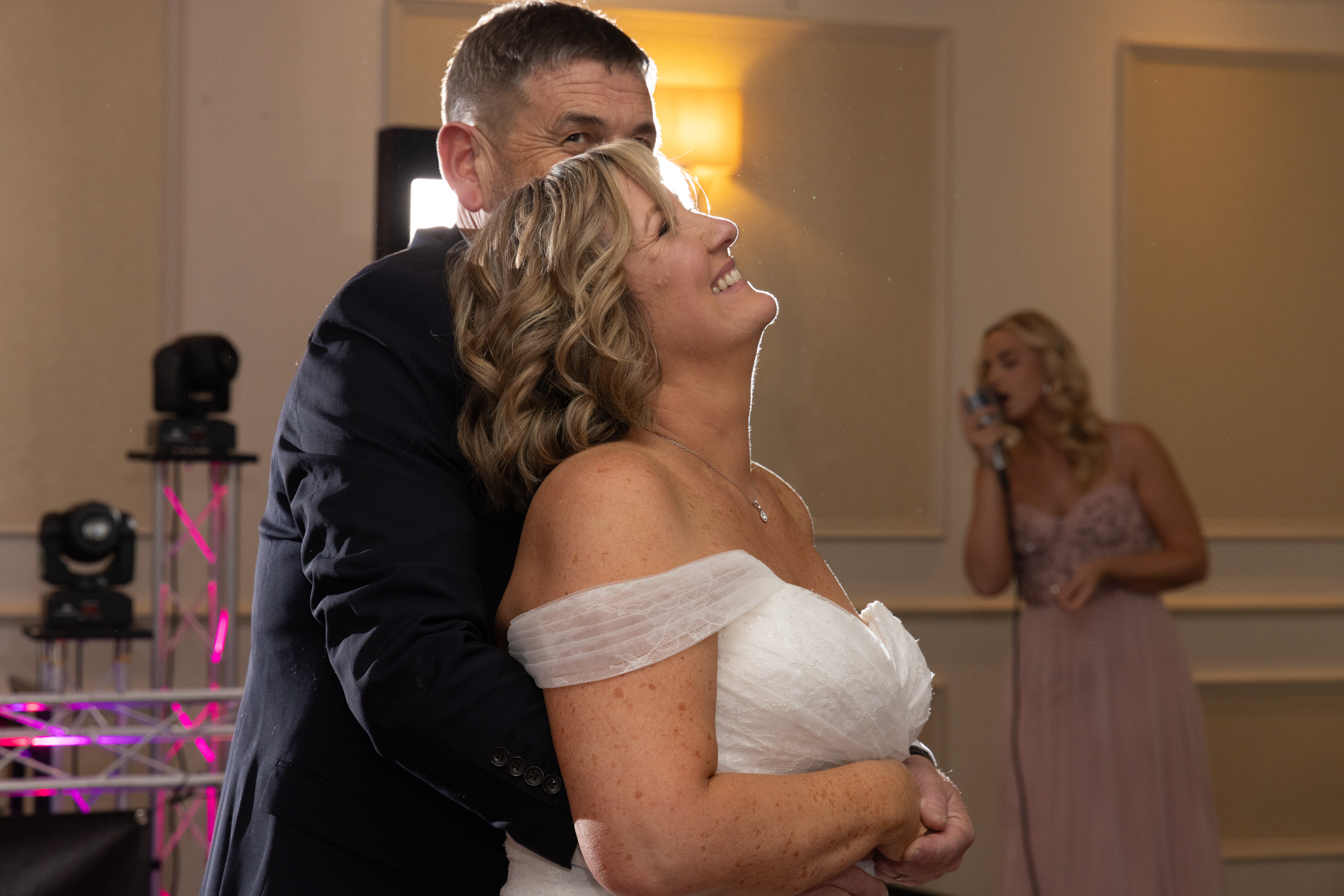 The bride and groom in joy their first dance