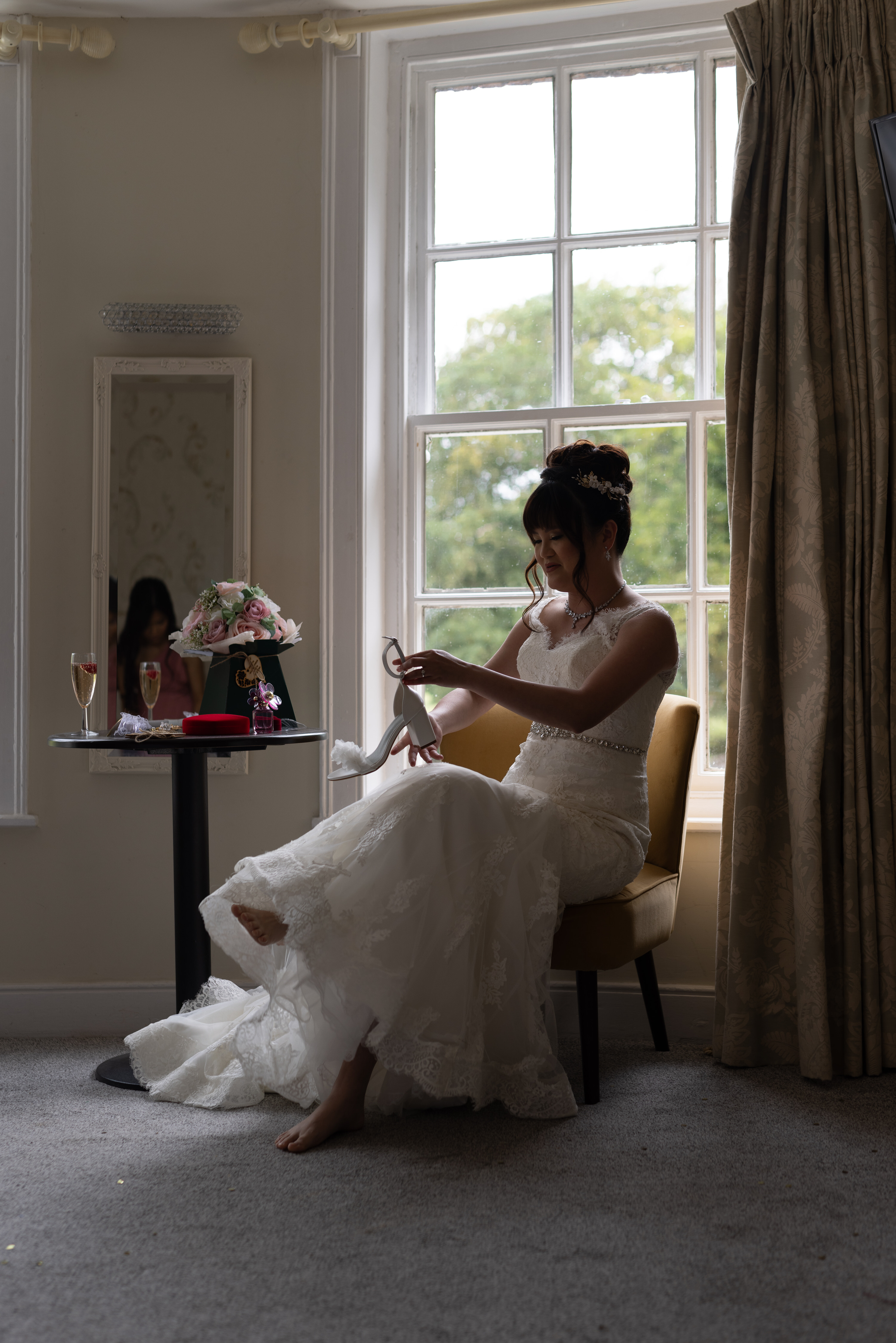 The Bride puts on her wedding shoes 