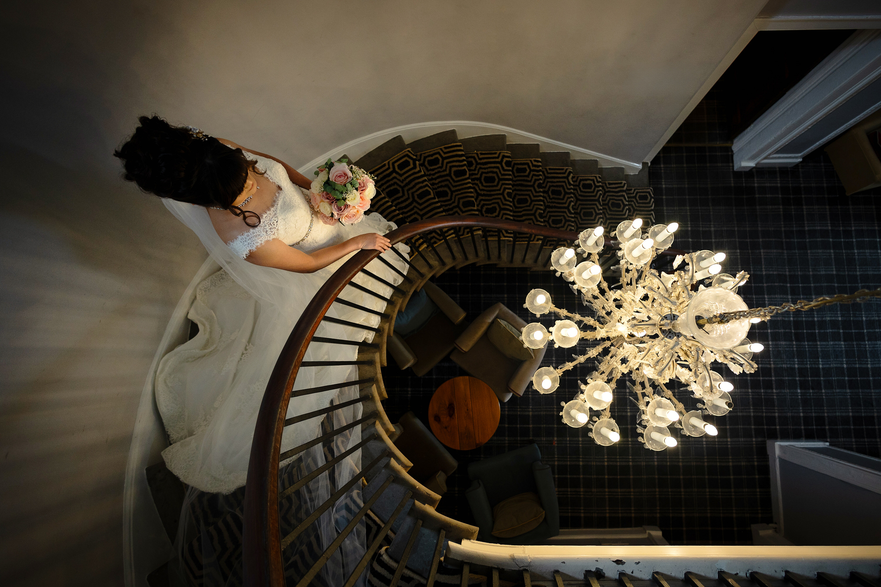 The Bride makes her way downstairs to the wedding ceremony 
