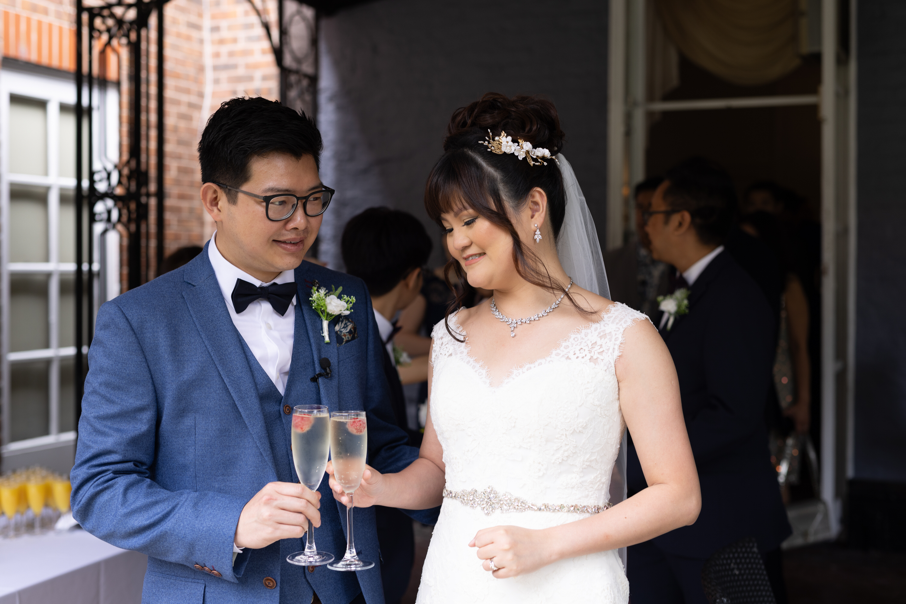 The bride and groom enjoying a glass of Champagne 