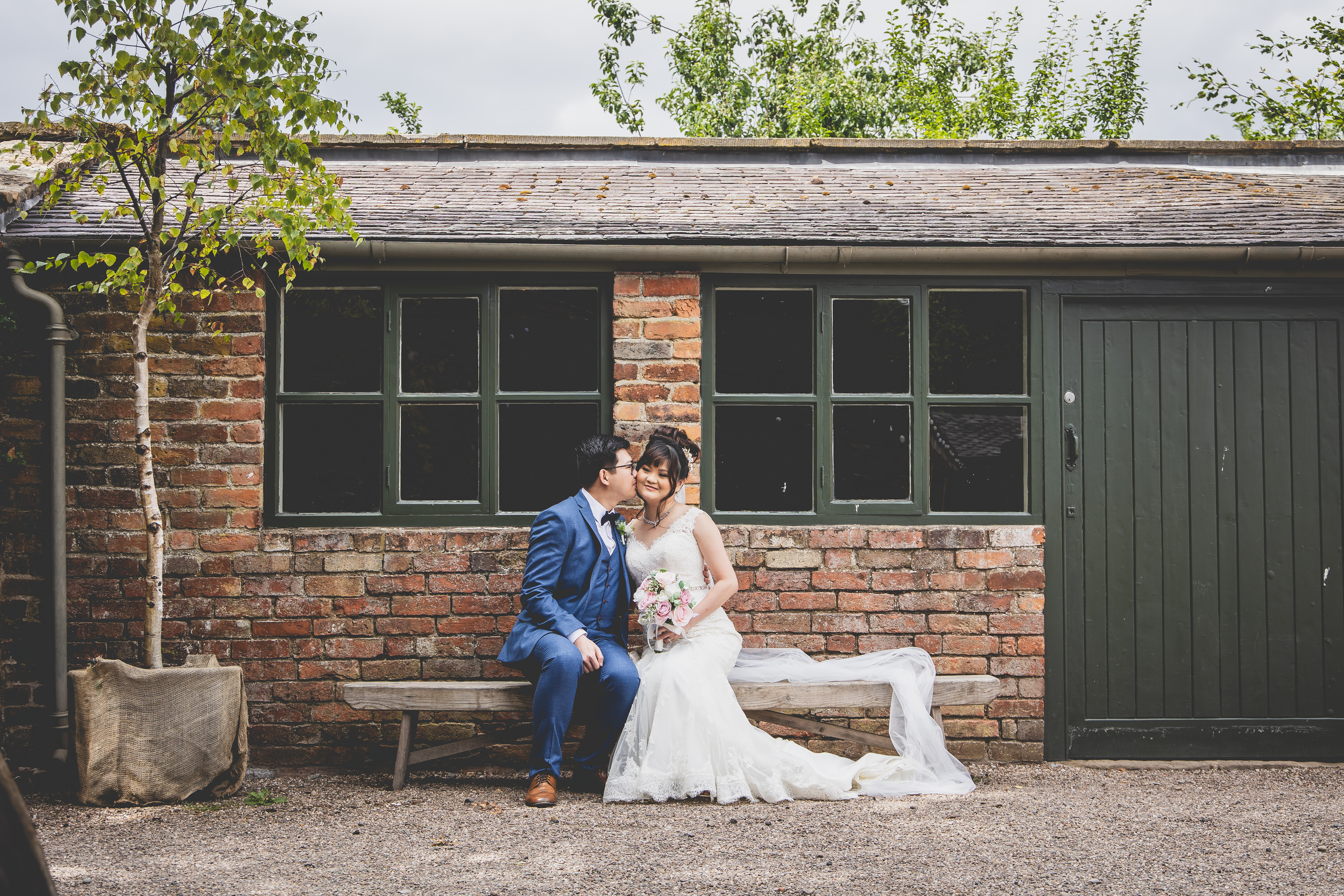 The bride and groom posing for their wedding photos 