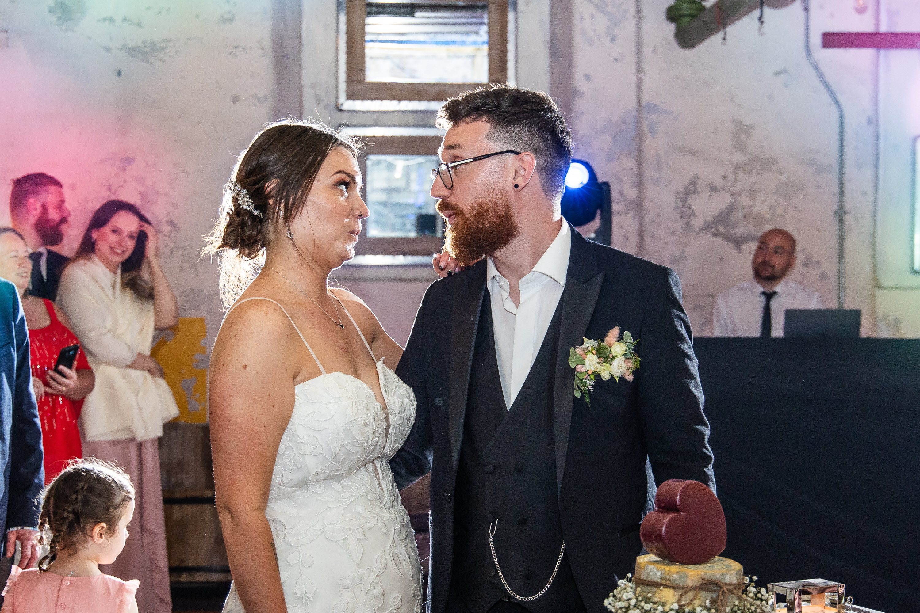 The bride and groom cut the cake