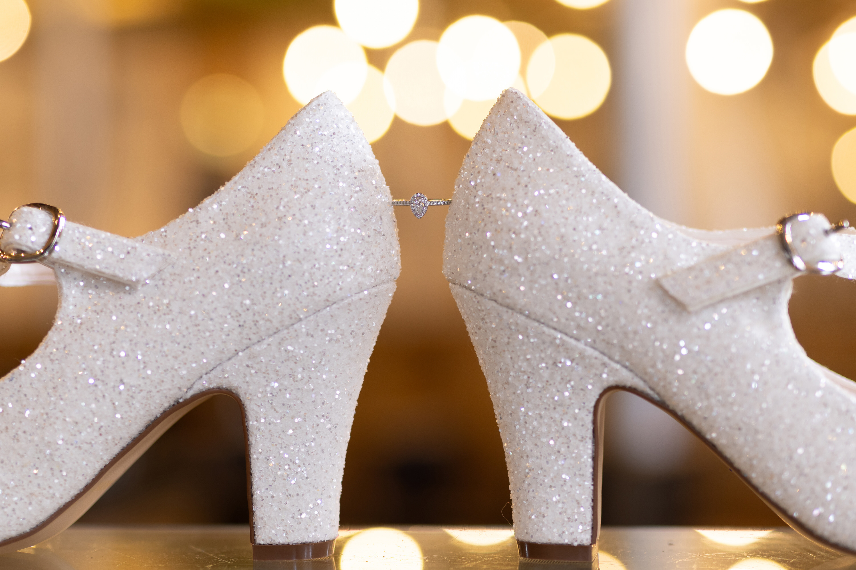 The  brides wedding shoes and engagement ring